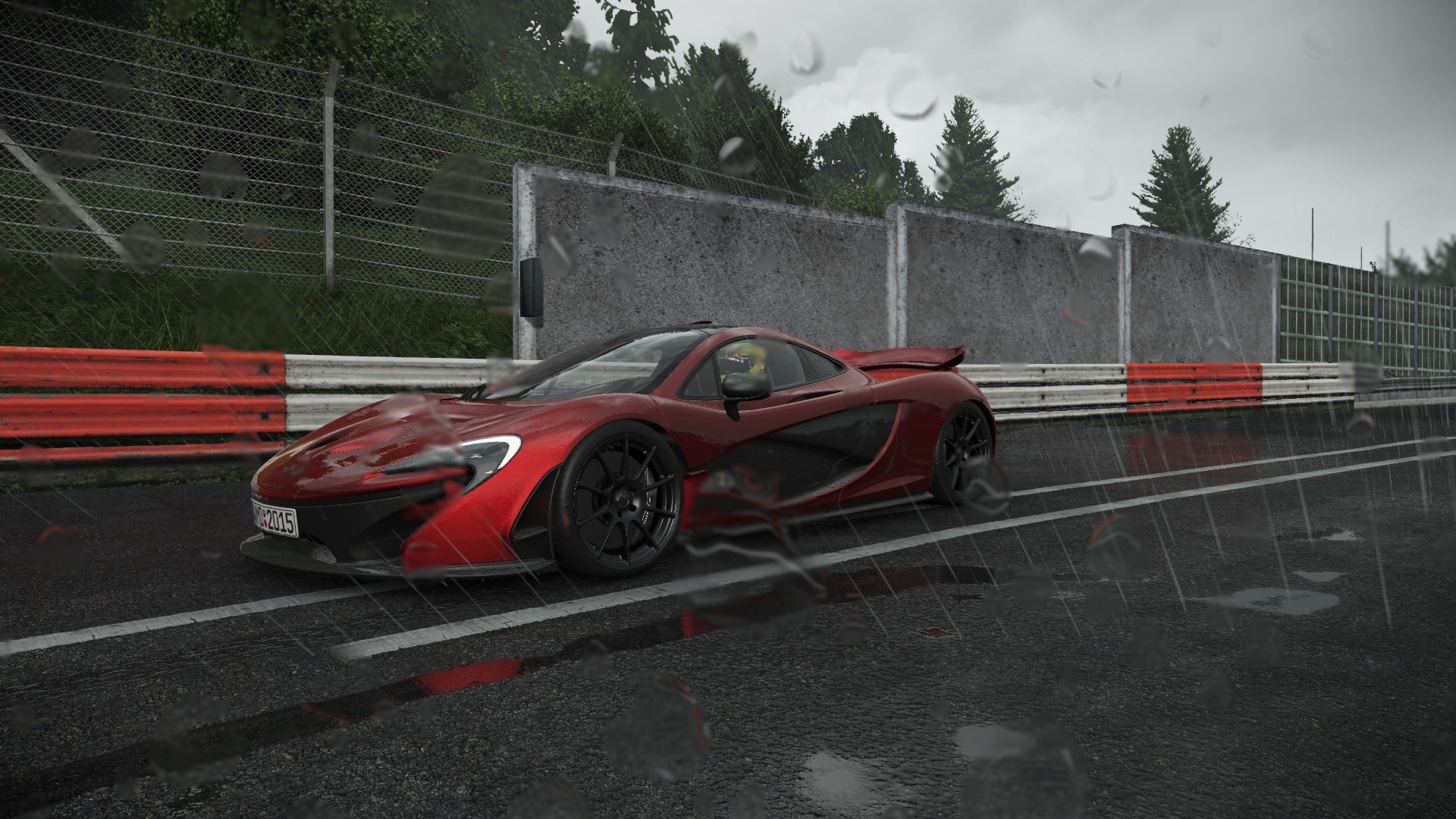 Red McLaren P1 sports car on a wet race track HD Wallpaper