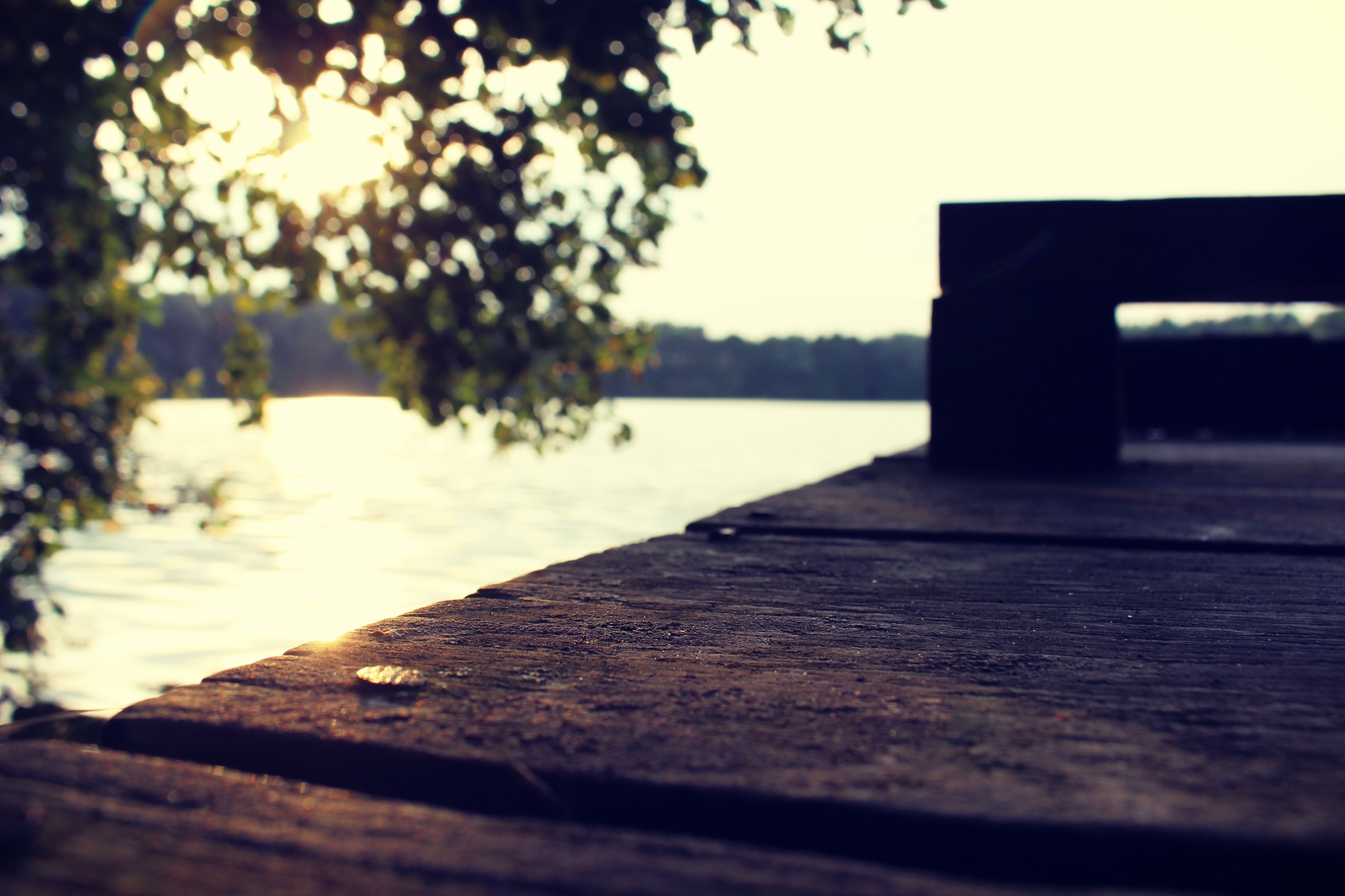 Wooden pier by a lake at sunset HD Wallpaper