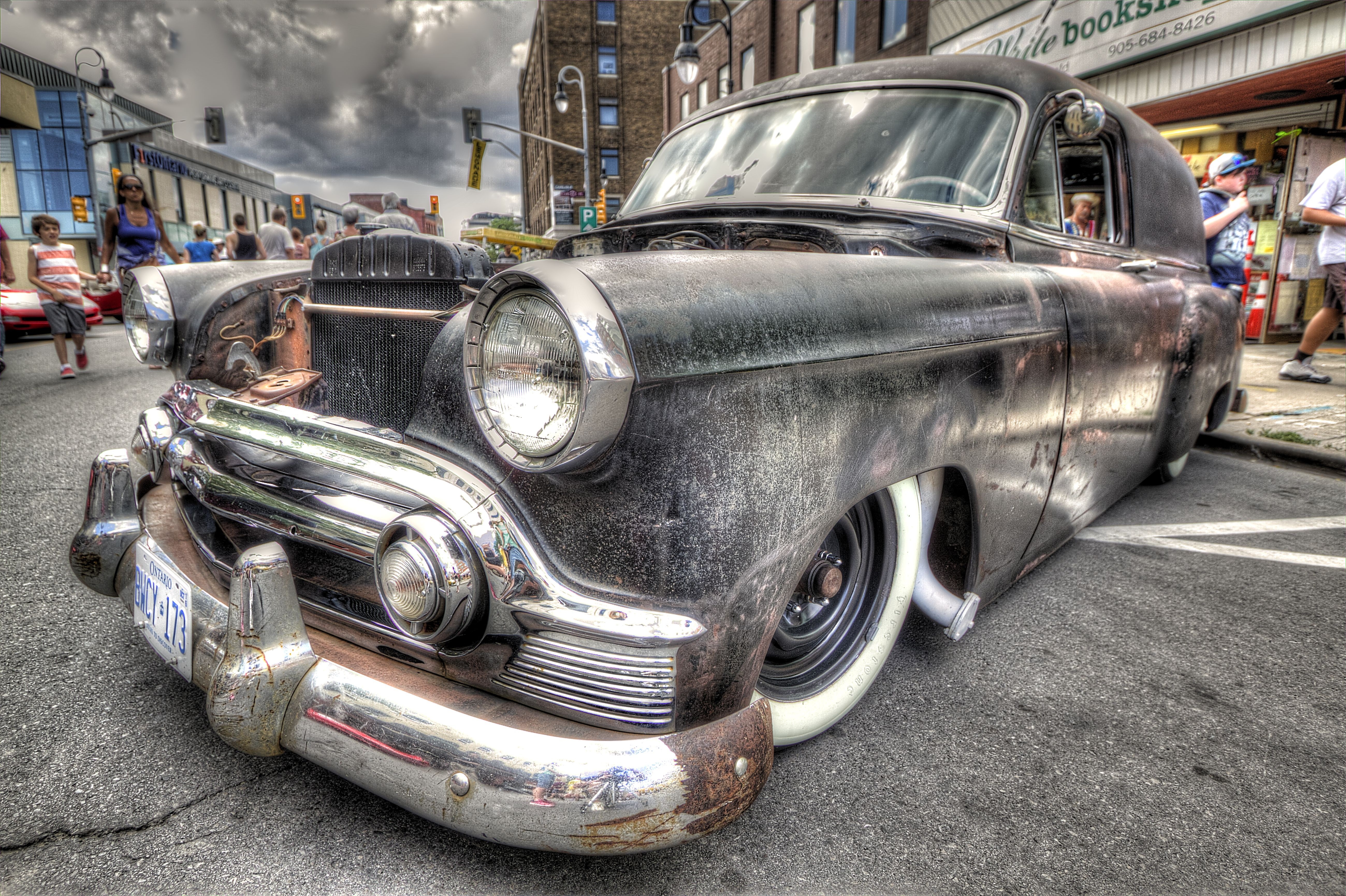 Customized vintage black sedan with whitewall tires HD Wallpaper