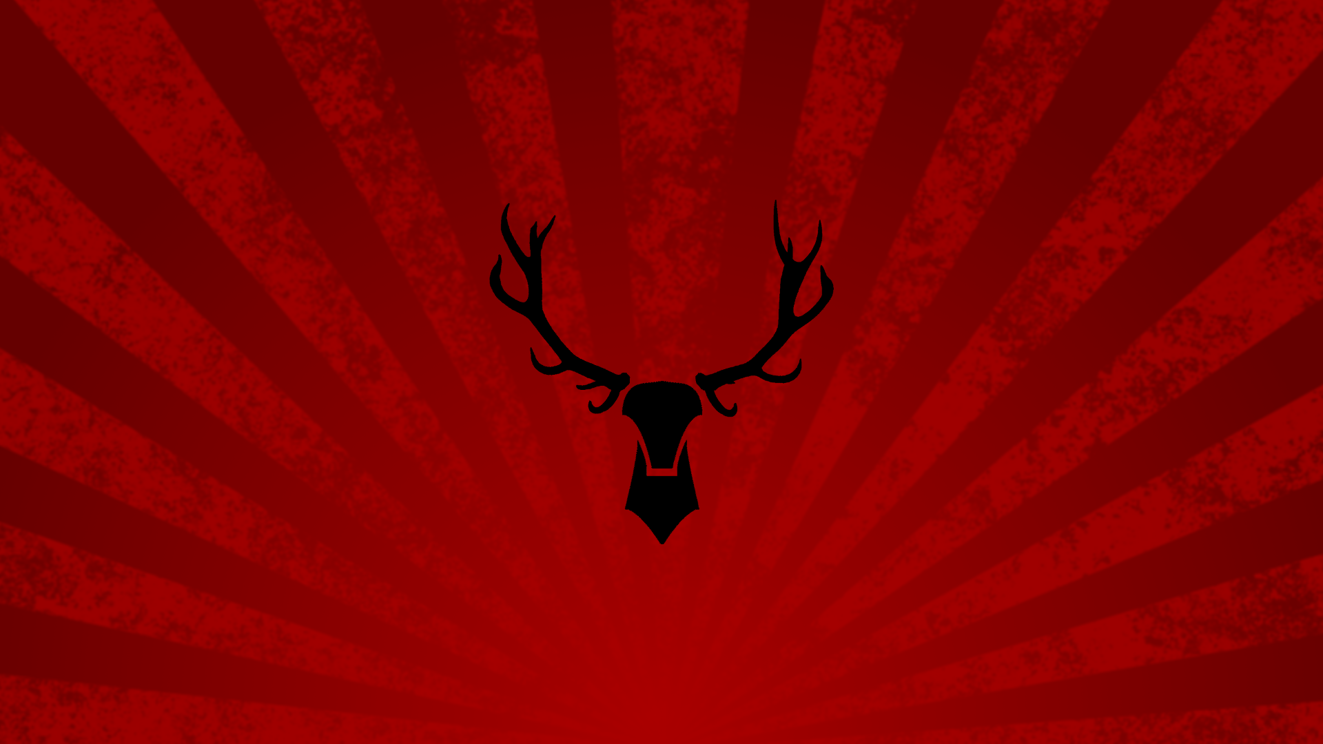 Black deer silhouette on red sunburst background HD Wallpaper