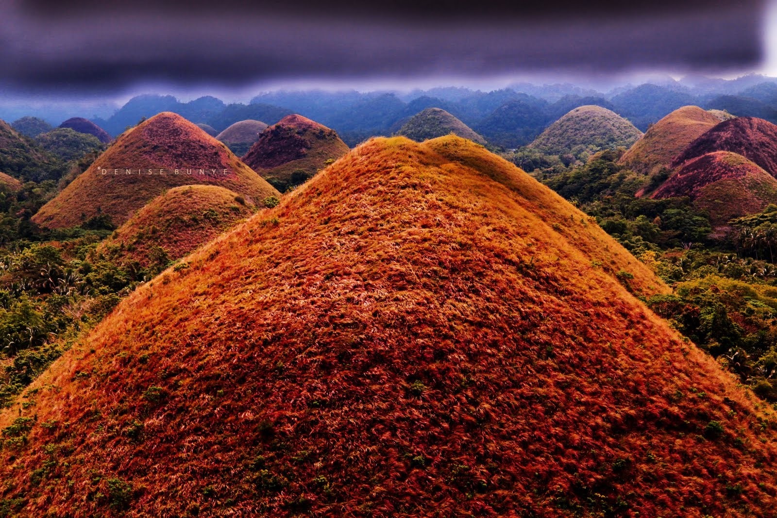 Chocolate Hills landscape with dramatic sky HD Wallpaper