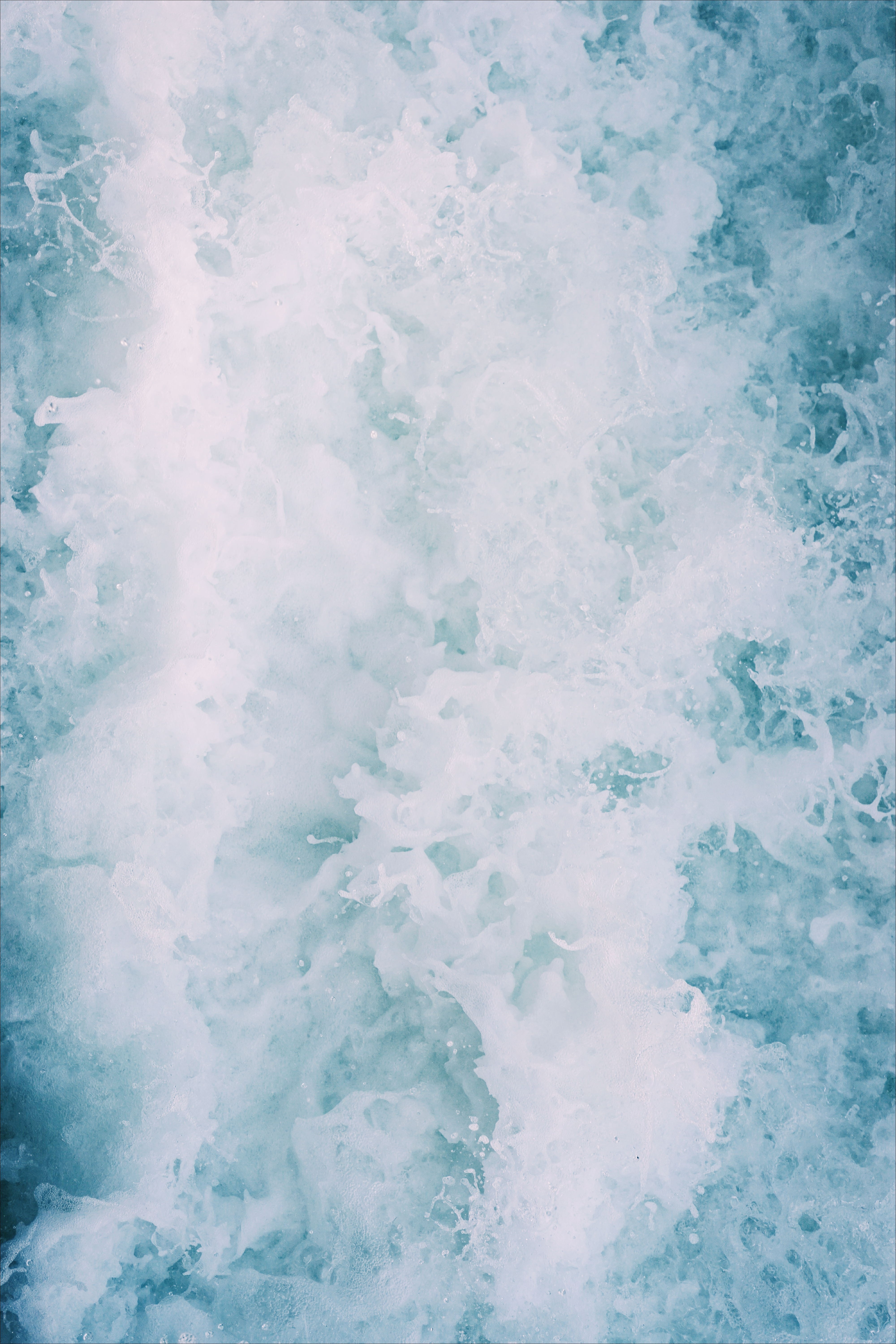 Abstract close-up of turbulent blue water with white foam HD Wallpaper
