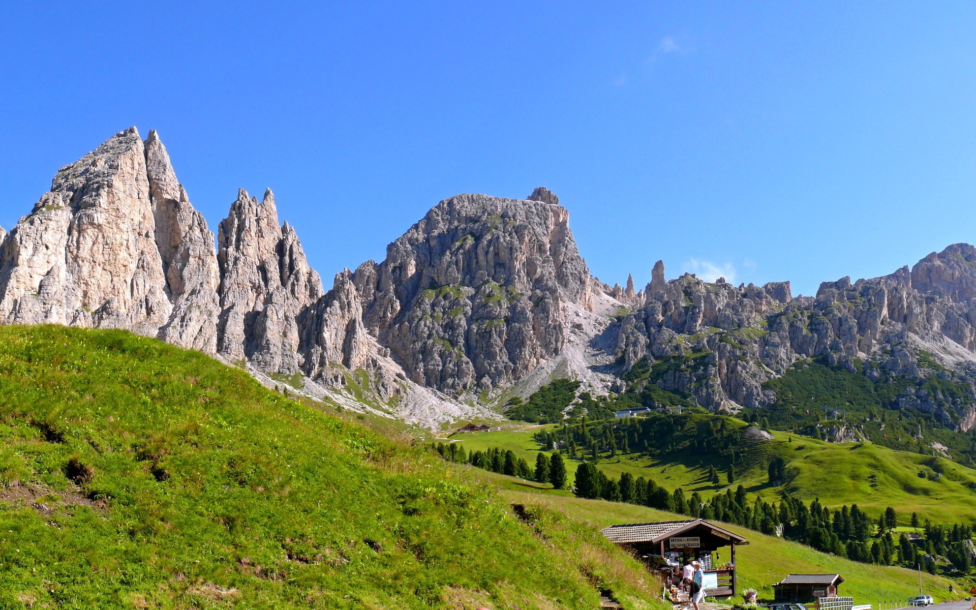 Mountain landscape with green hills and rocky peaks HD Wallpaper