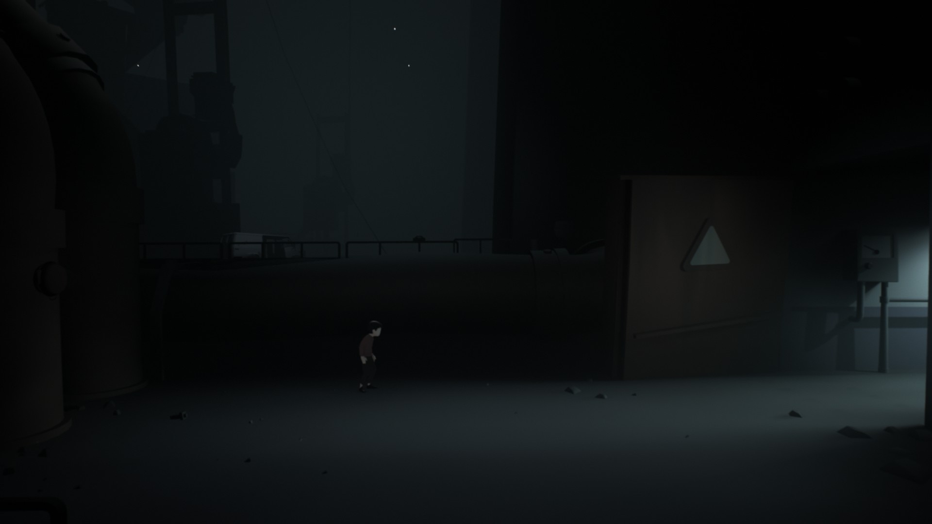 Boy in dark industrial area from Inside HD Wallpaper