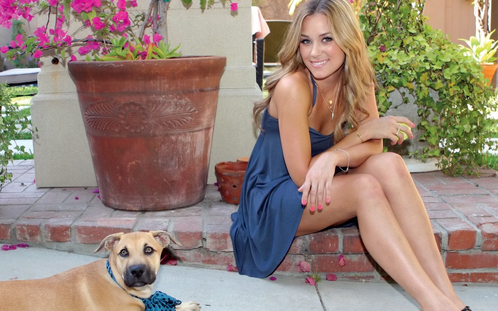 Woman and dog sitting outdoors HD Wallpaper