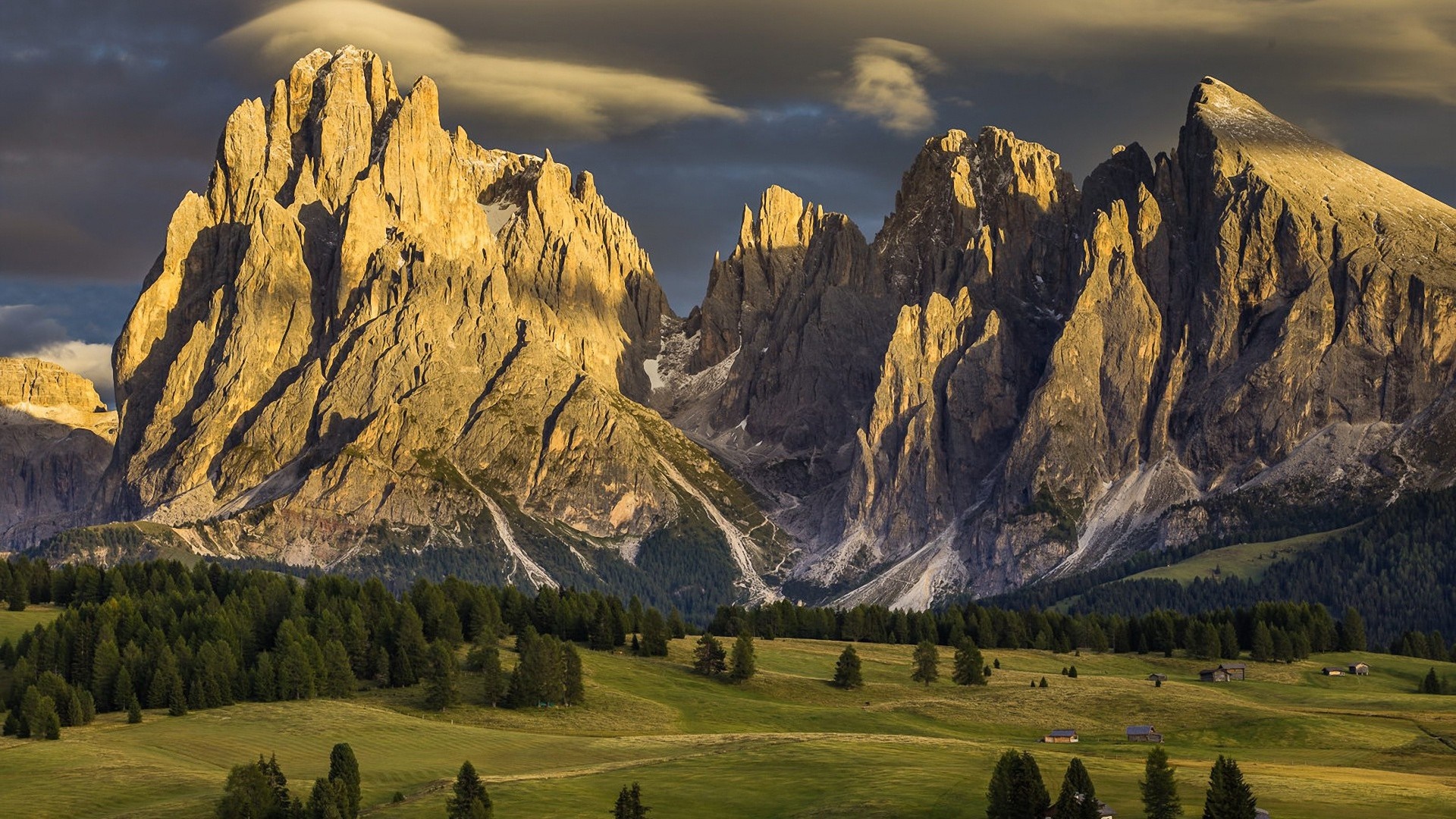 Golden mountain peaks at sunset with green valley HD Wallpaper