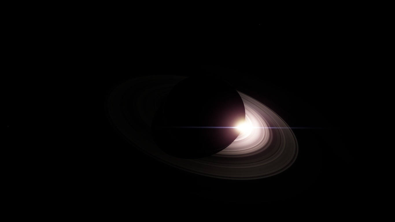 Saturn with bright sun flare and rings HD Wallpaper