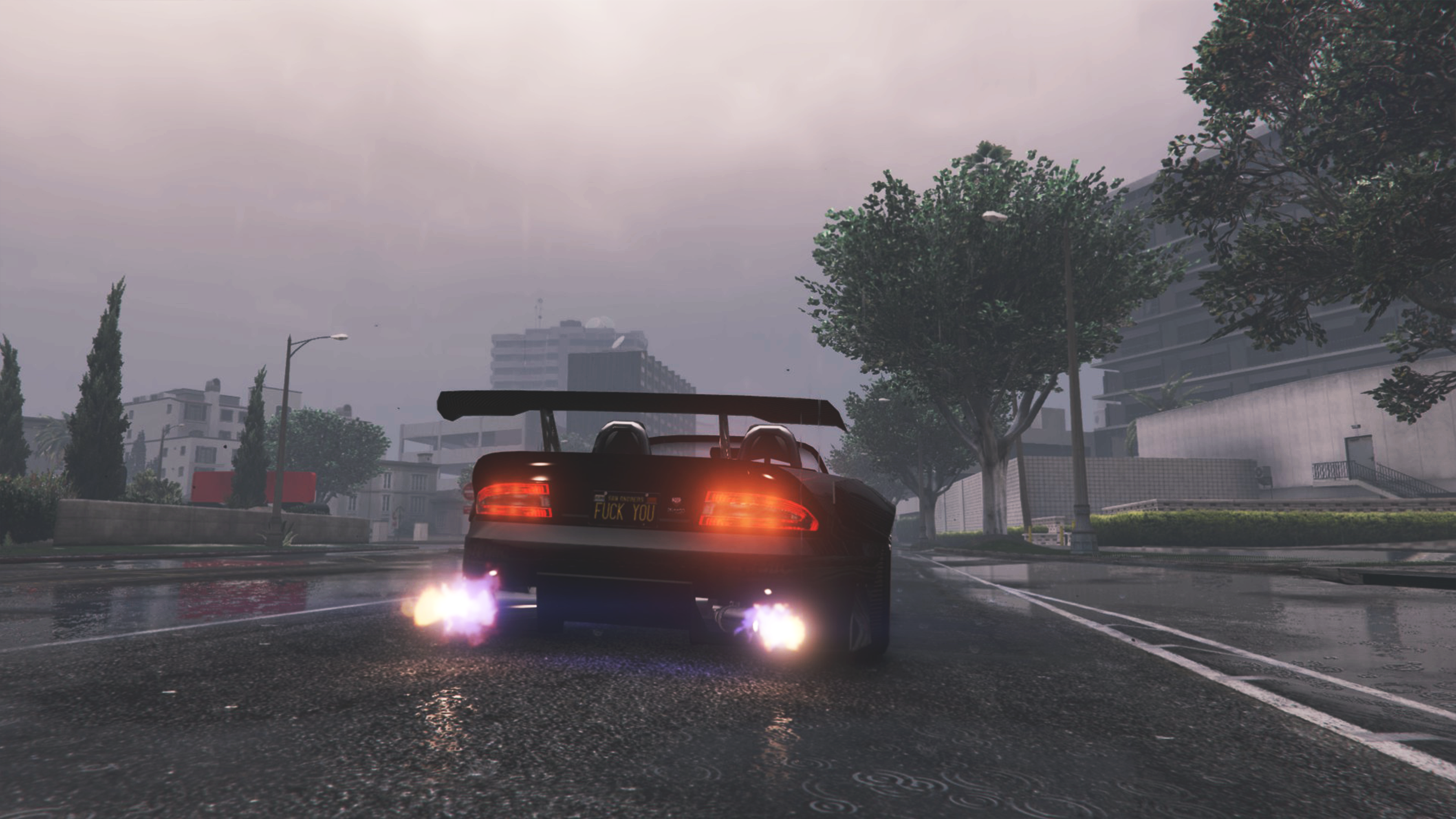 Sports car with flames driving on a wet road HD Wallpaper
