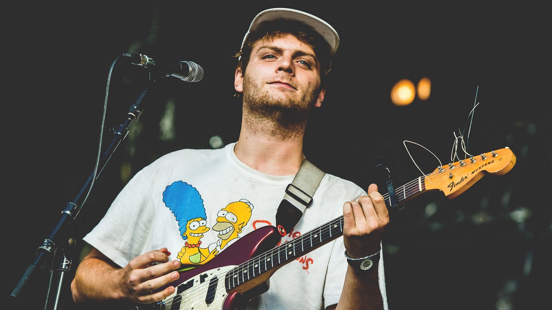 Mac Demarco playing guitar on stage HD Wallpaper