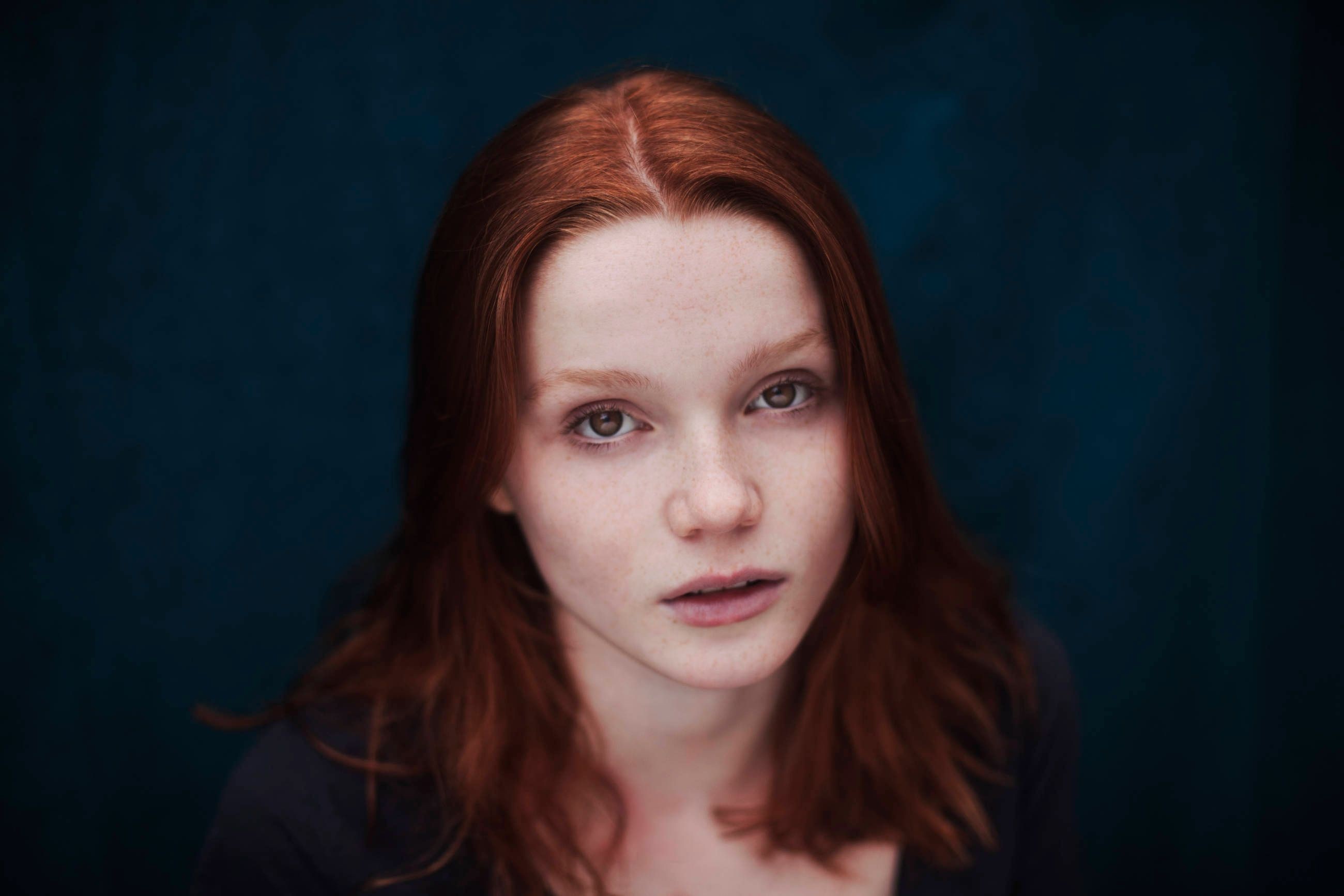 Redhead woman with freckles looking at viewer HD Wallpaper