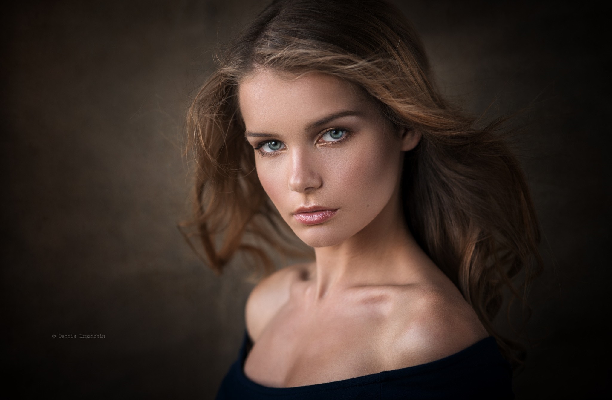 Woman with flowing brown hair and blue eyes HD Wallpaper