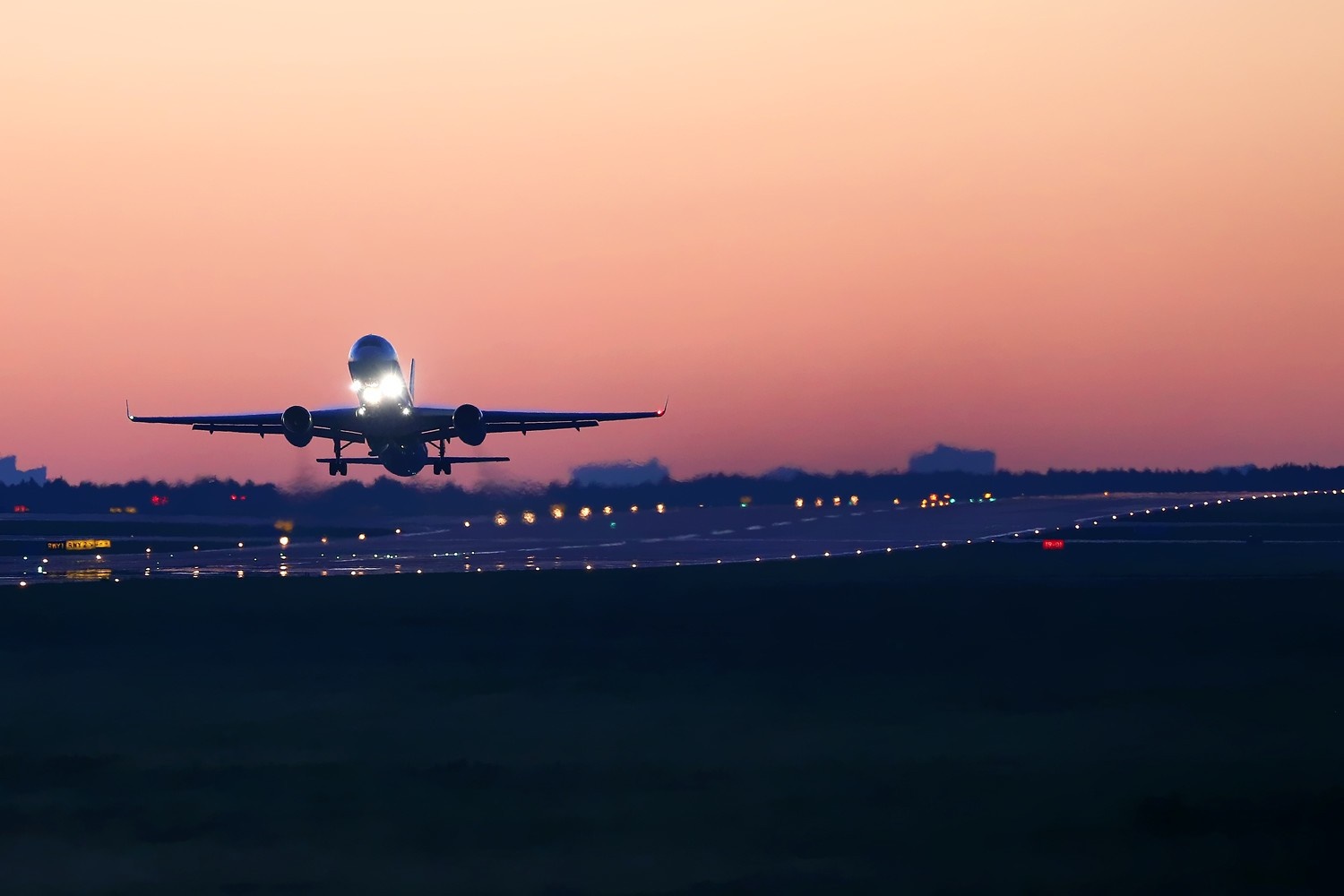 Airplane taking off at sunset on runway HD Wallpaper