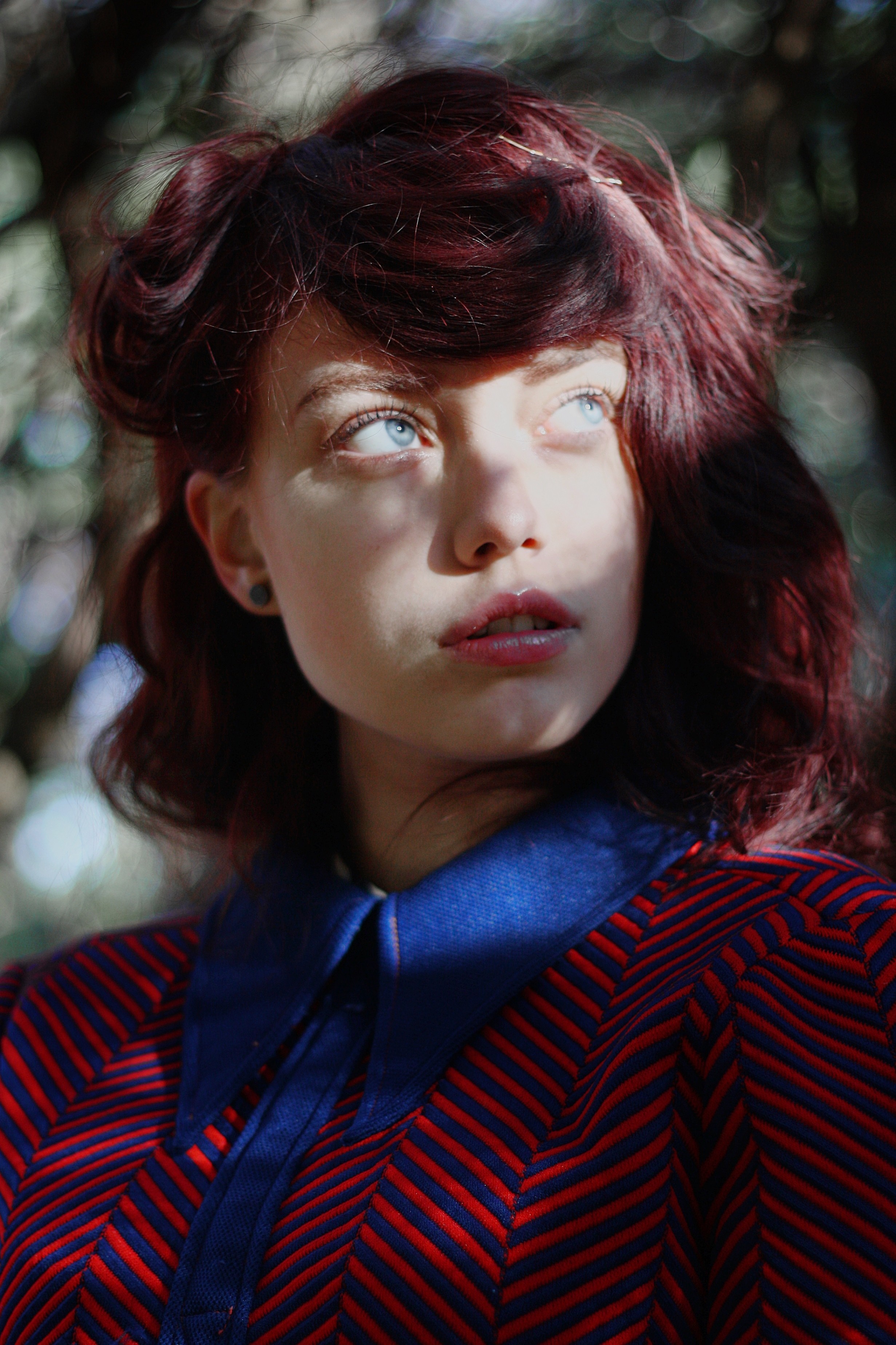 Woman with dyed red hair and blue eyes in a patterned shirt HD Wallpaper