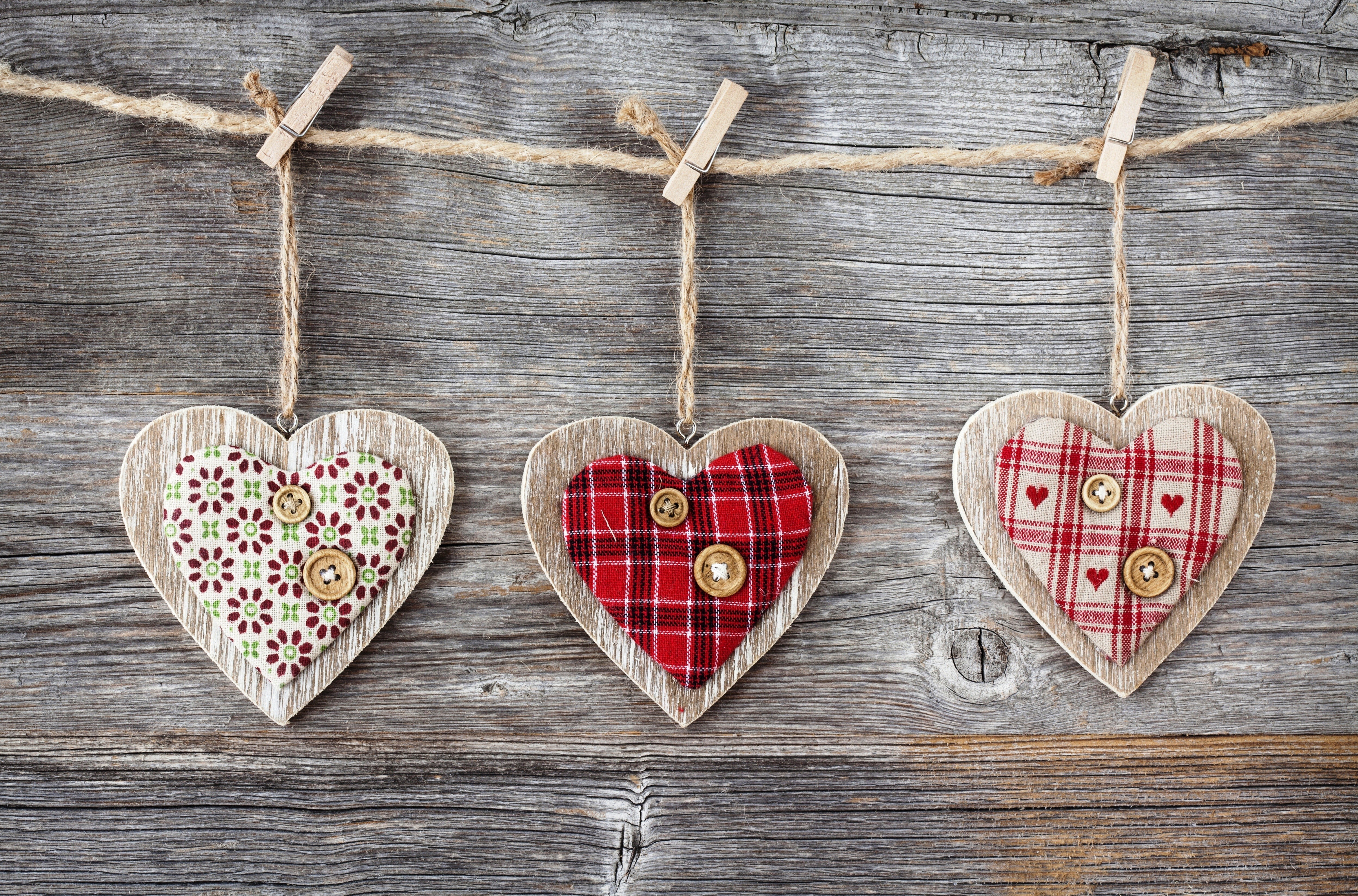 Three decorative hearts hanging on a clothesline HD Wallpaper