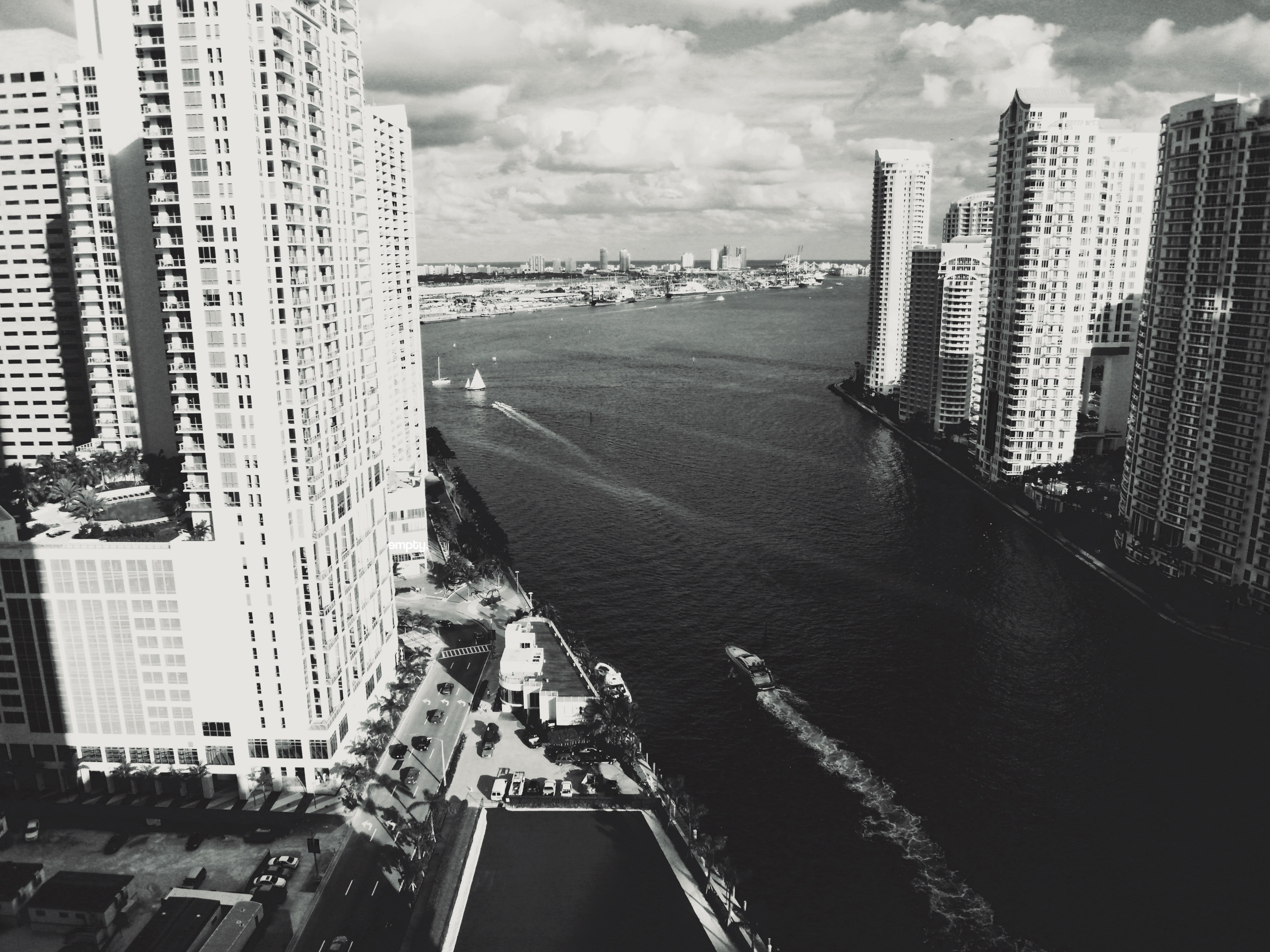 Black and white aerial view of Miami cityscape with skyscrapers and river HD Wallpaper