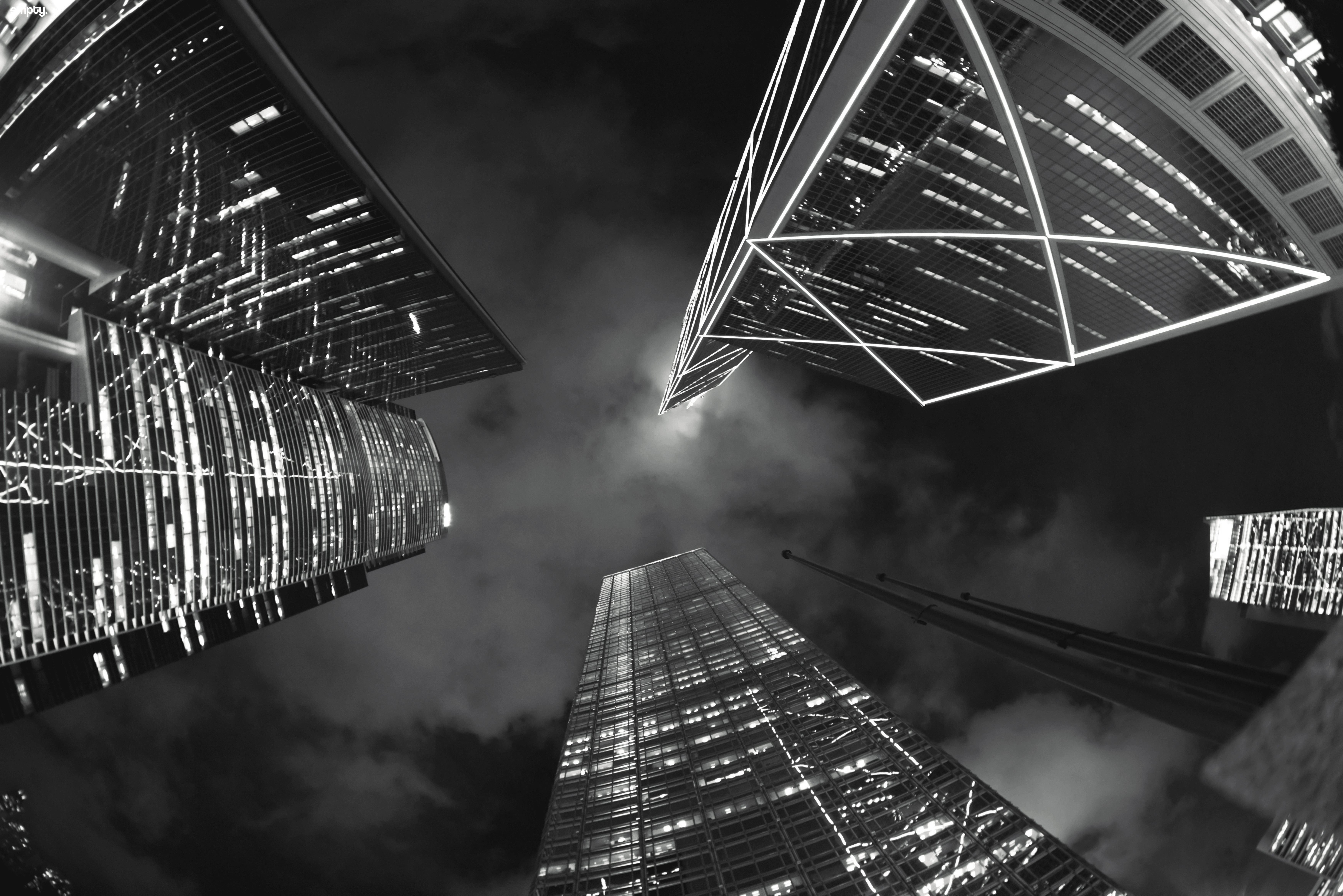 Monochrome night cityscape with skyscrapers looking up HD Wallpaper