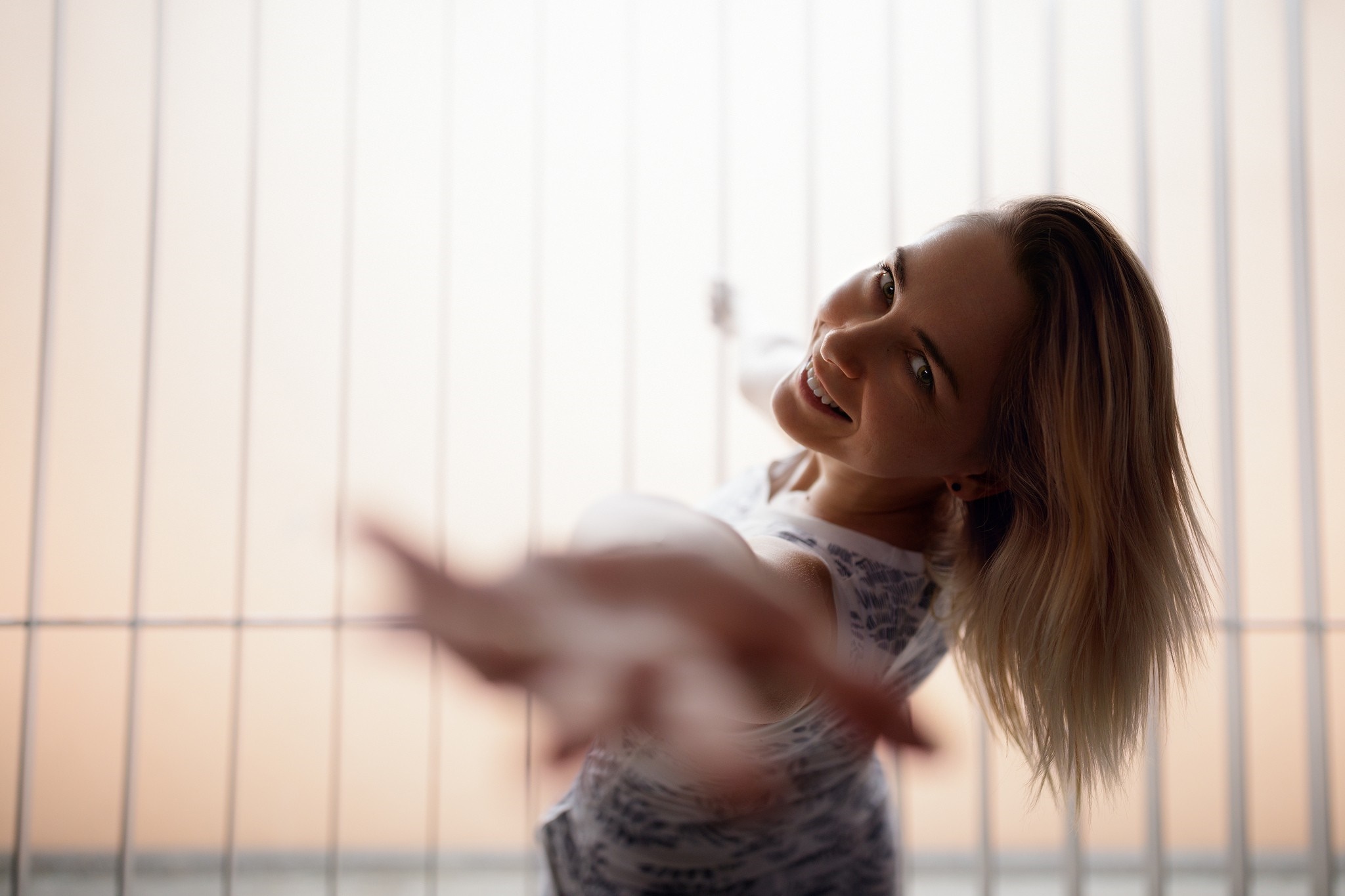 Woman with blonde hair reaching out HD Wallpaper