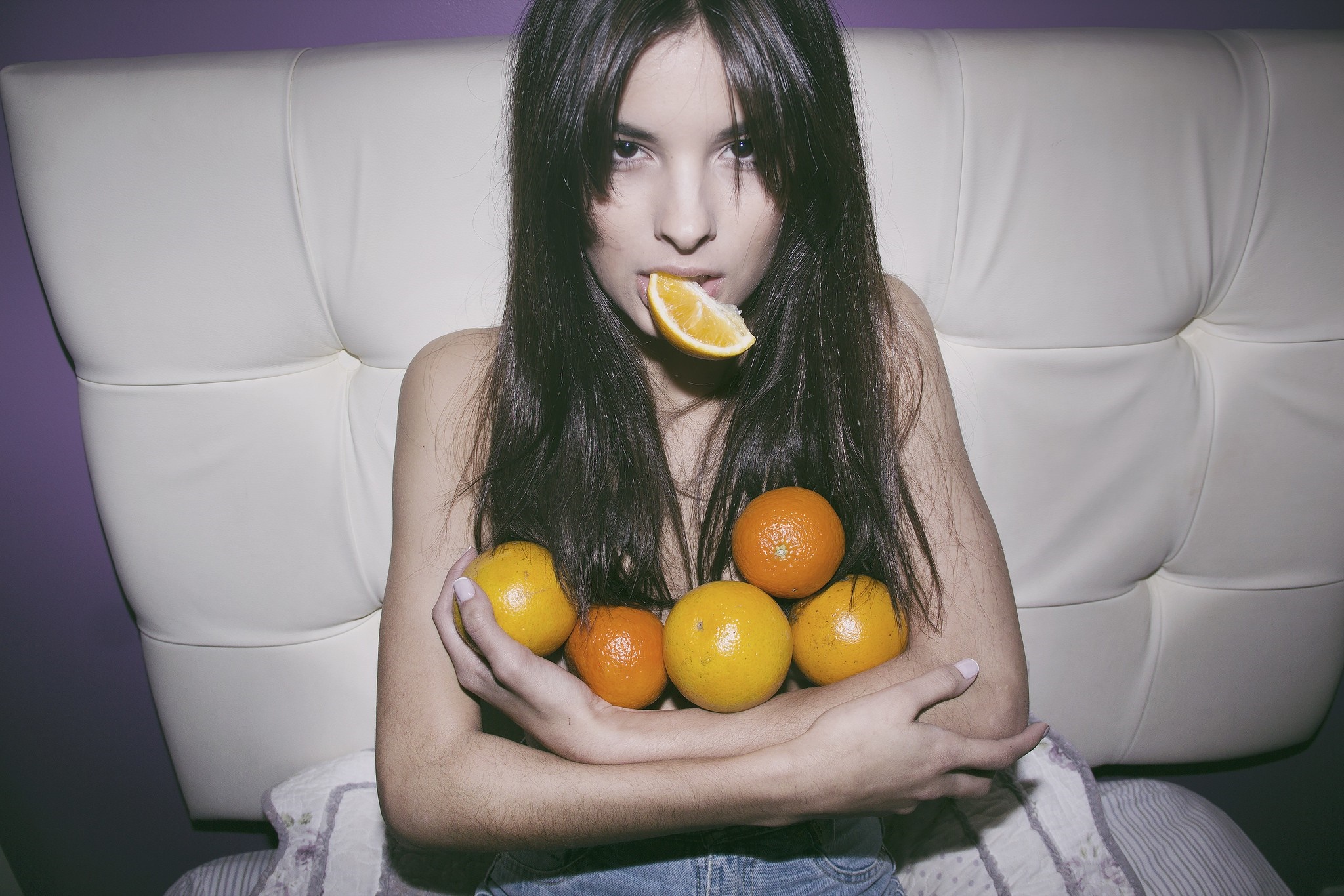 Woman with oranges and orange slice HD Wallpaper