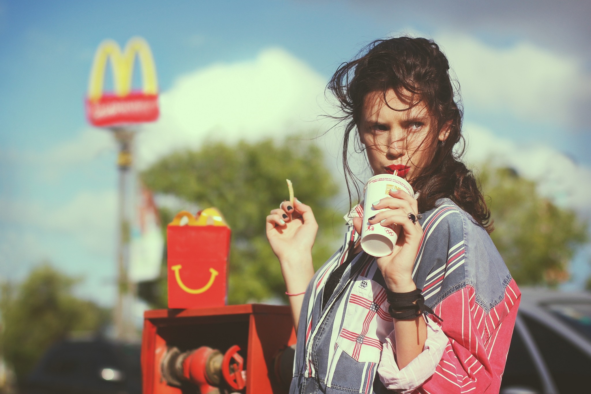 Woman drinking at McDonald's with fries HD Wallpaper