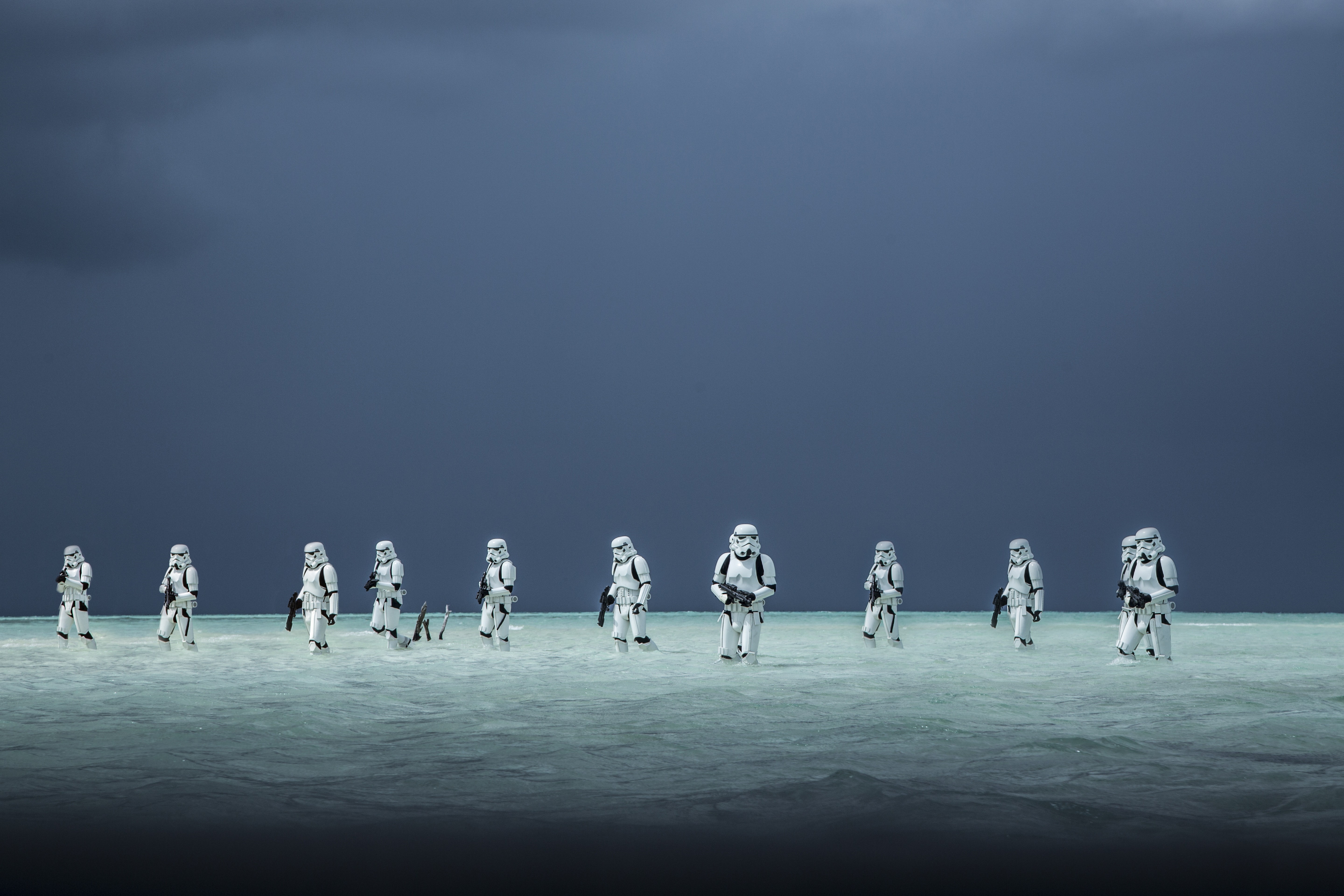 Stormtroopers from Rogue One: A Star Wars Story walking in shallow water HD Wallpaper