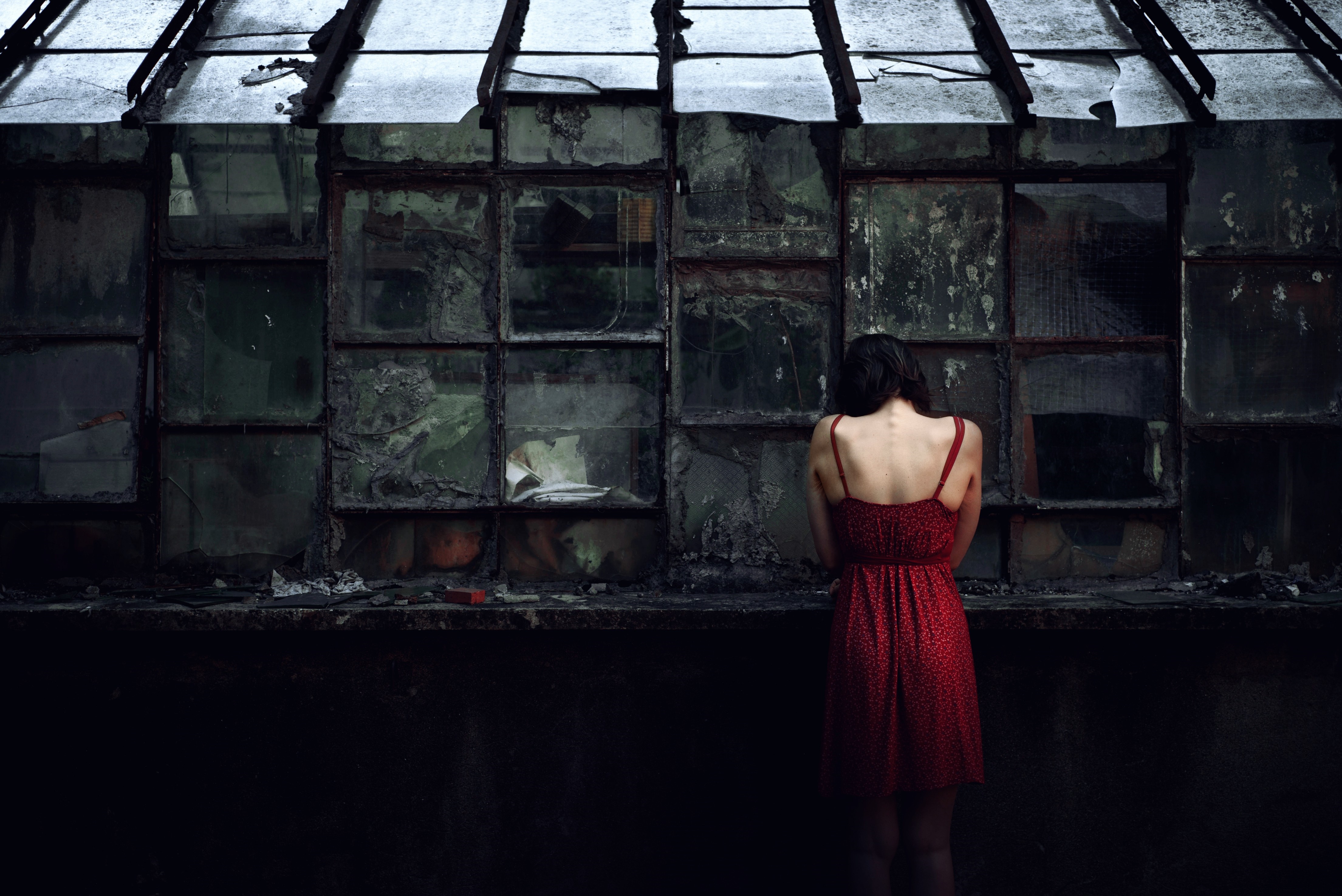 Woman in red dress in abandoned building HD Wallpaper