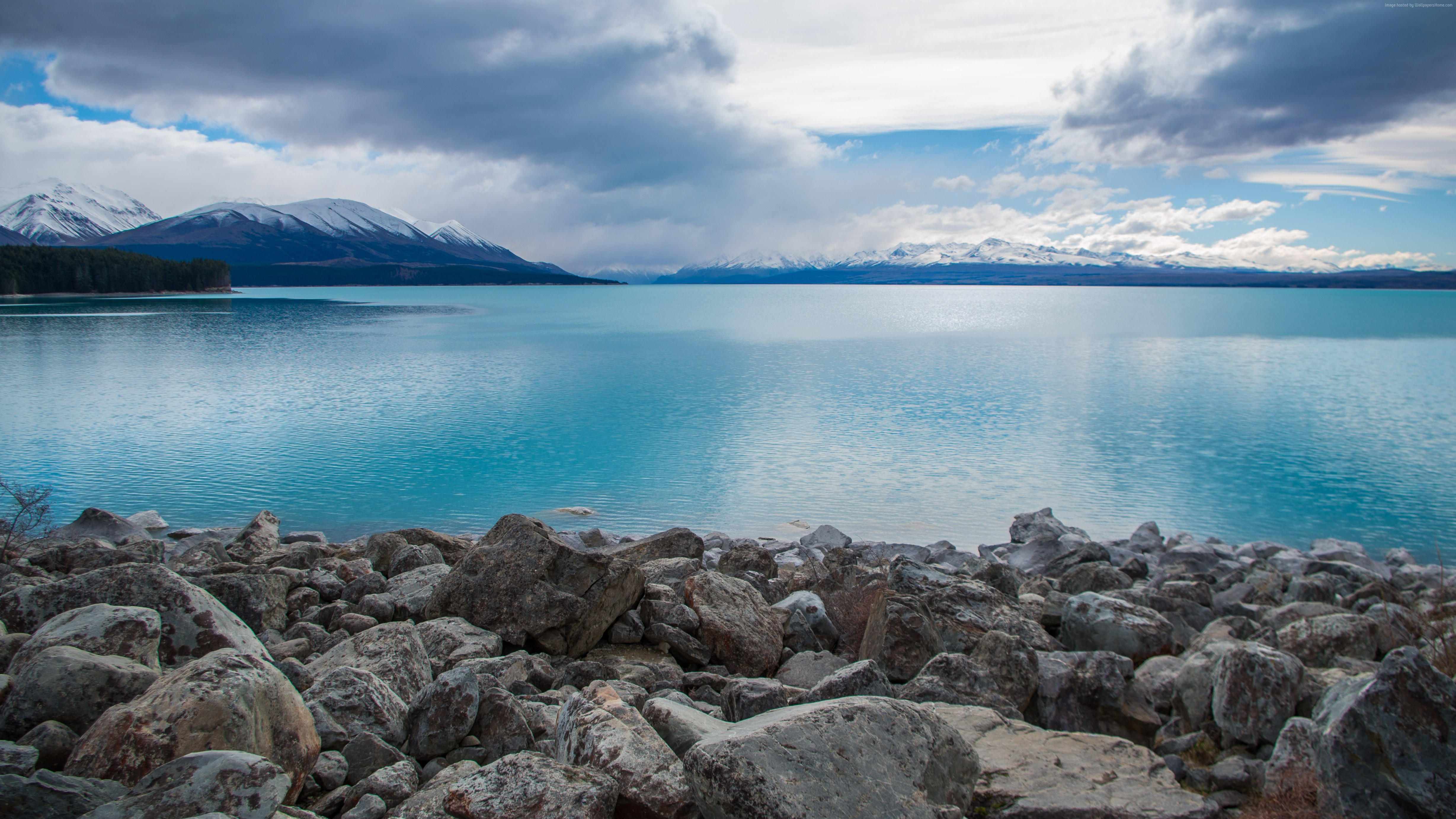 Lake Pukaki with Snow-Capped Mountains and Stones HD Wallpaper
