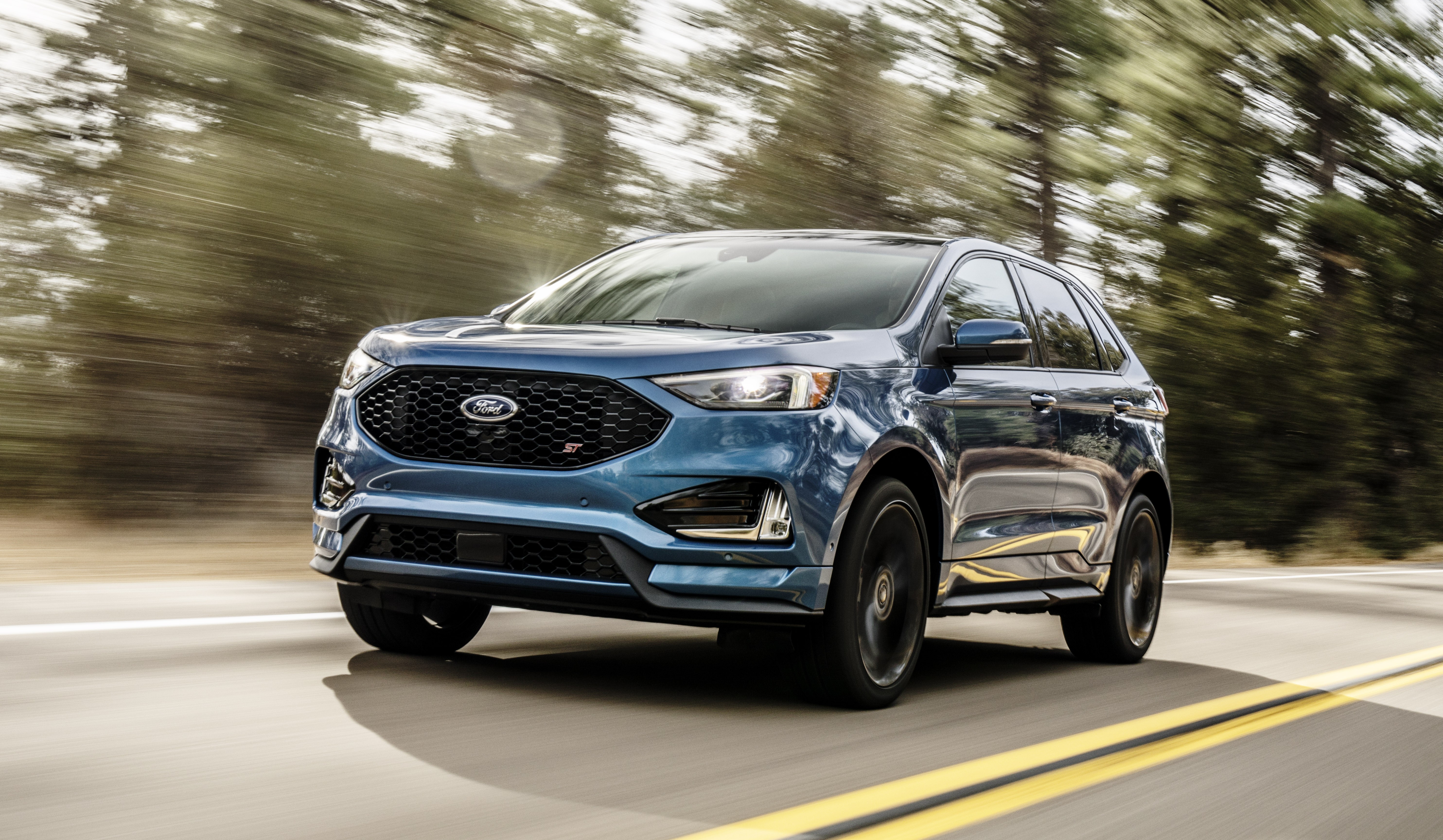 Blue Ford Edge ST driving on a road HD Wallpaper