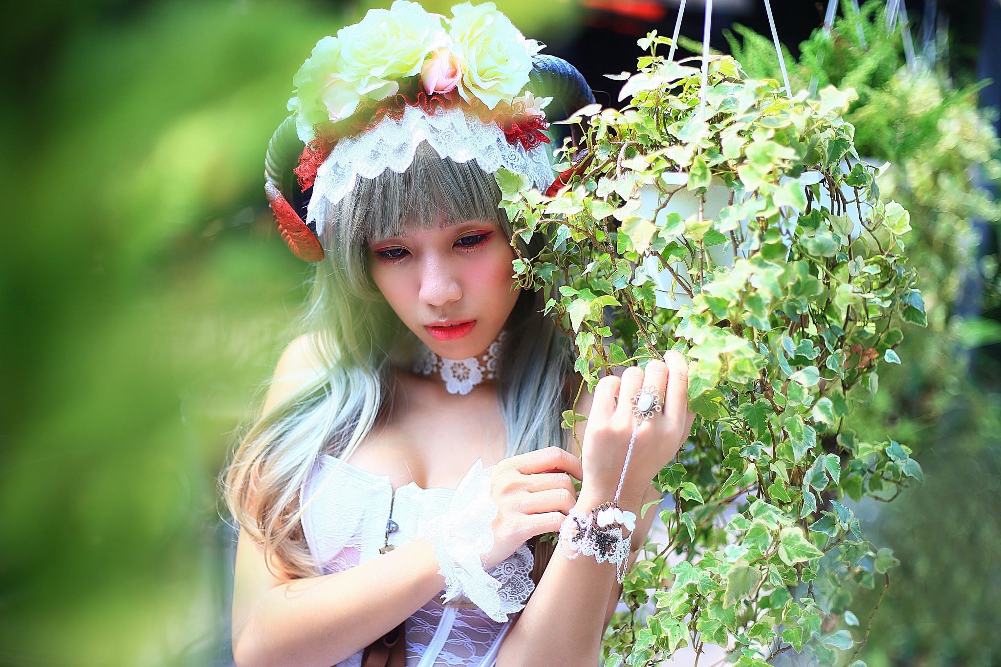 Woman in fairy costume with horns and flowers HD Wallpaper