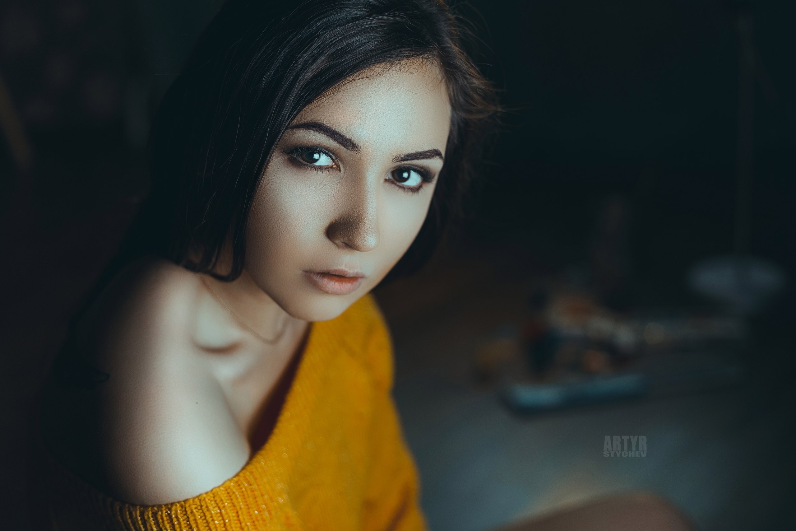Woman with dark hair wearing a yellow sweater HD Wallpaper