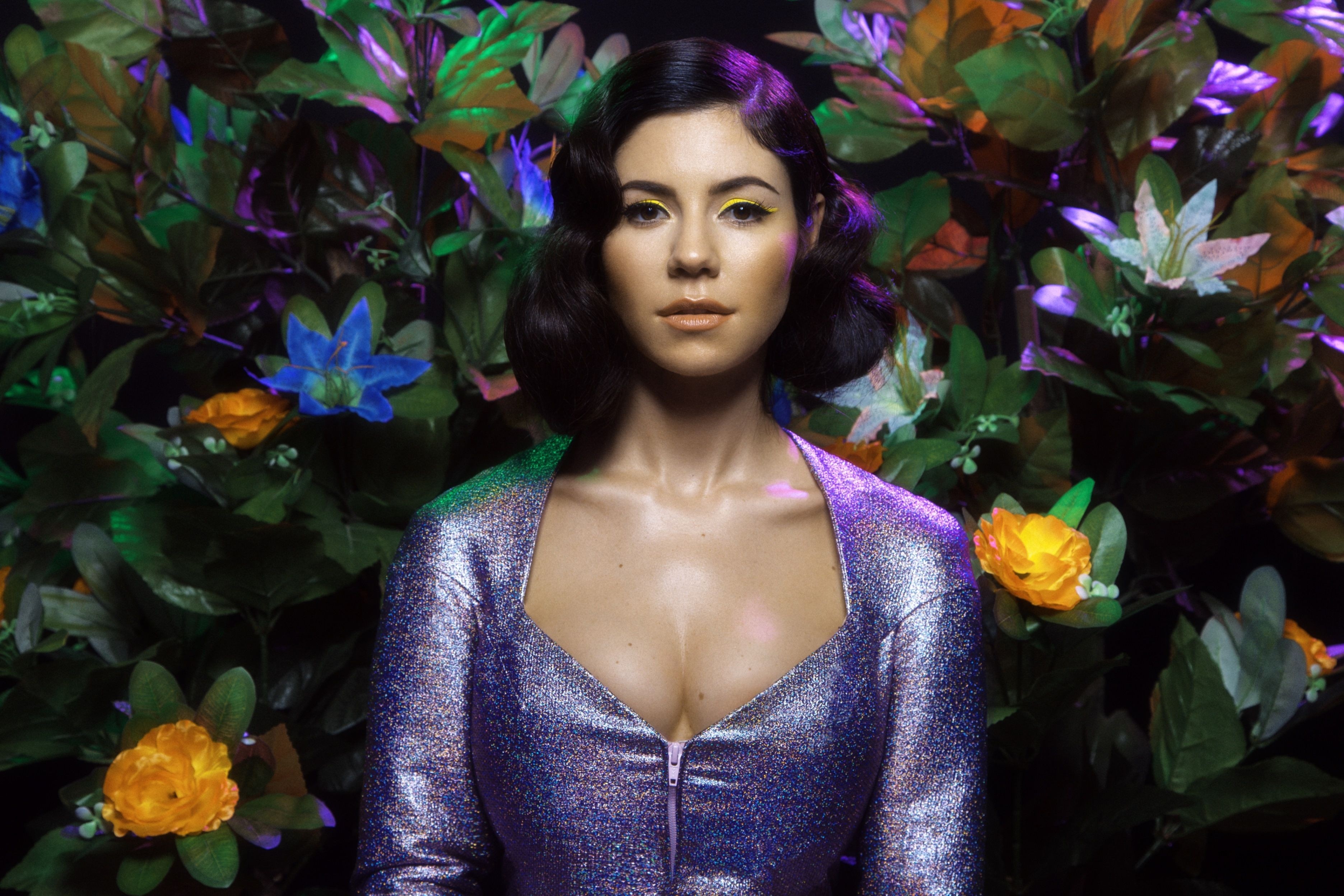 Marina Diamandis in a sparkly purple dress with flowers HD Wallpaper