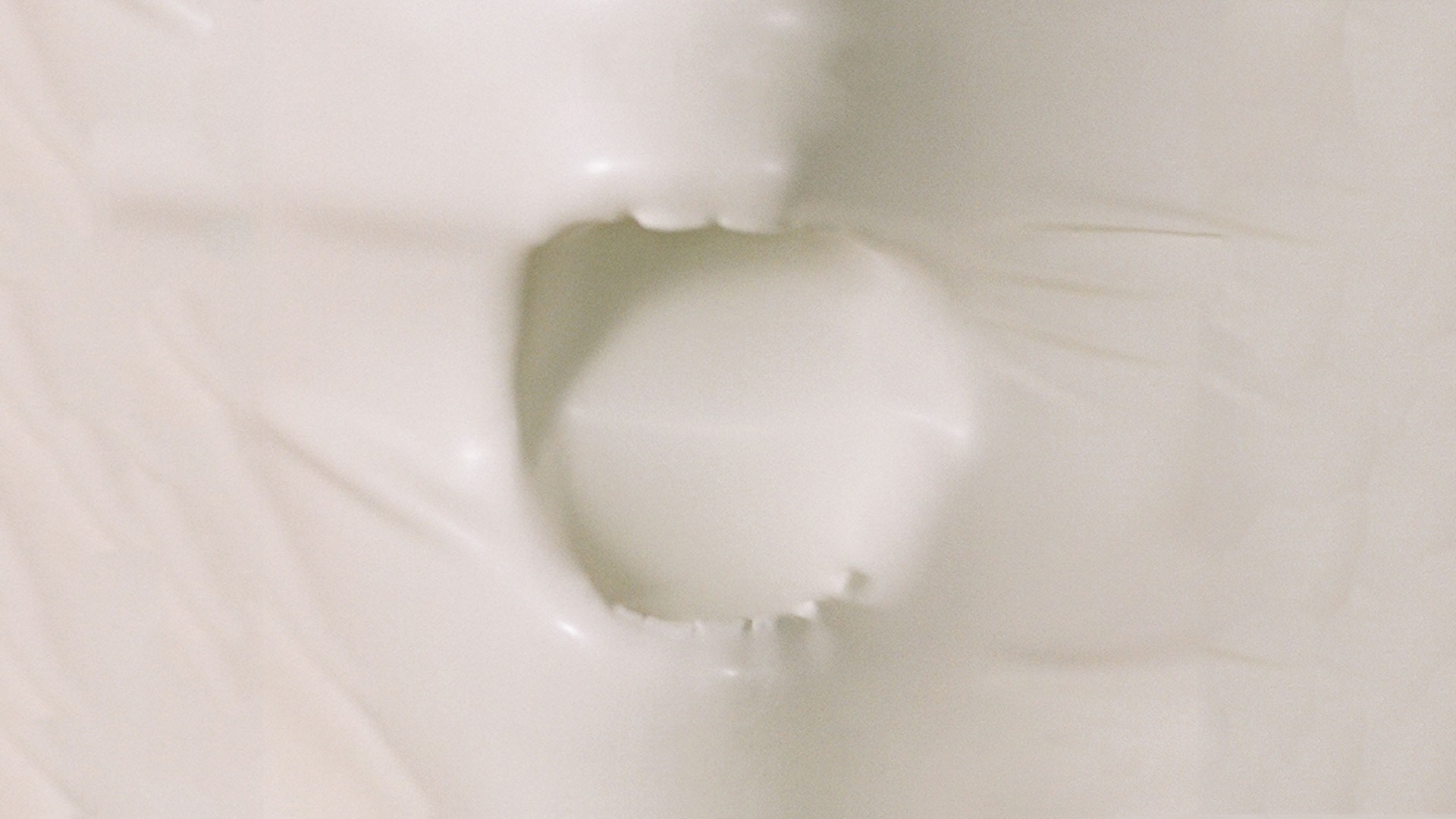 Close-up of a mouth with teeth through white material HD Wallpaper