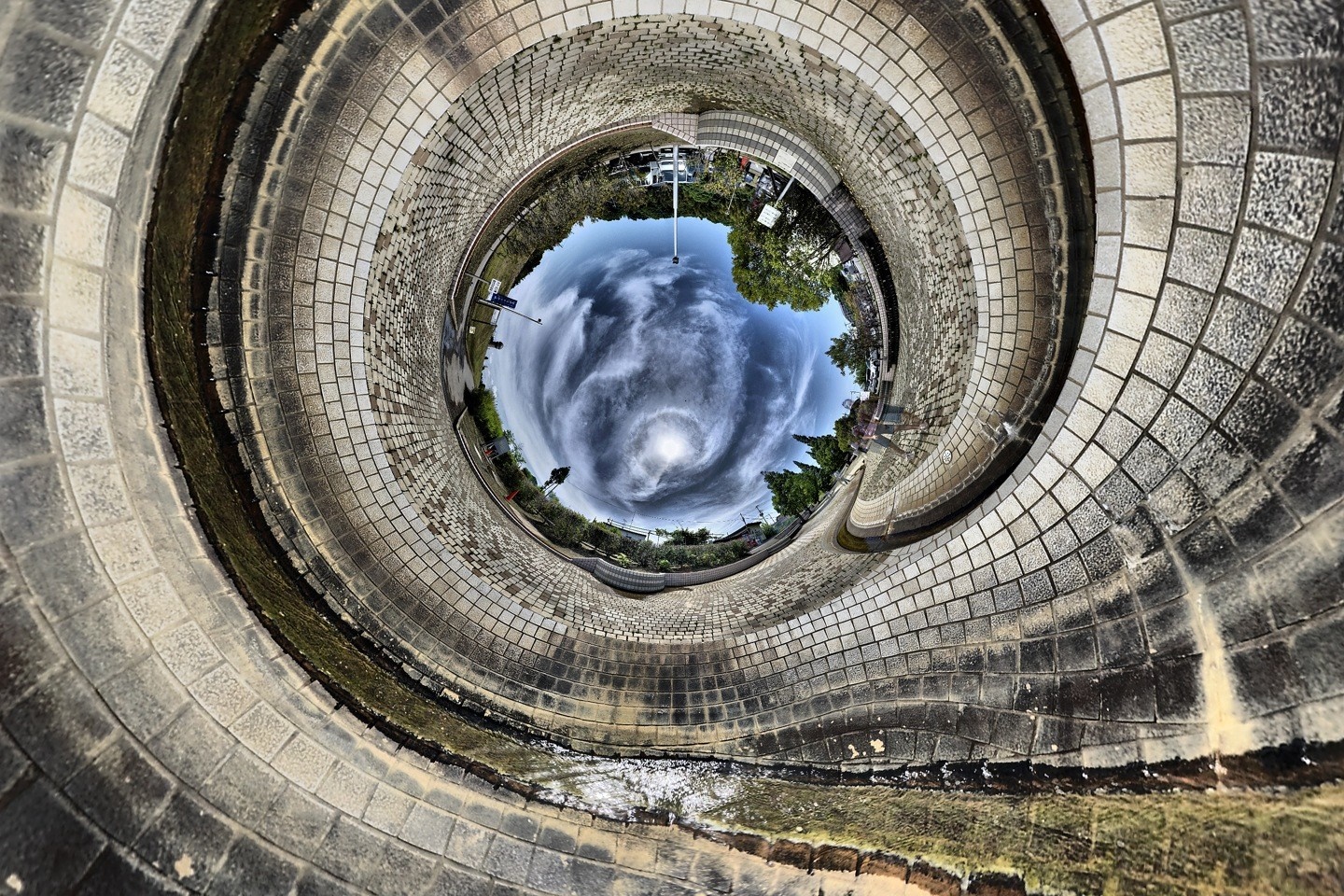 Circular view of tiled pathway and sky HD Wallpaper