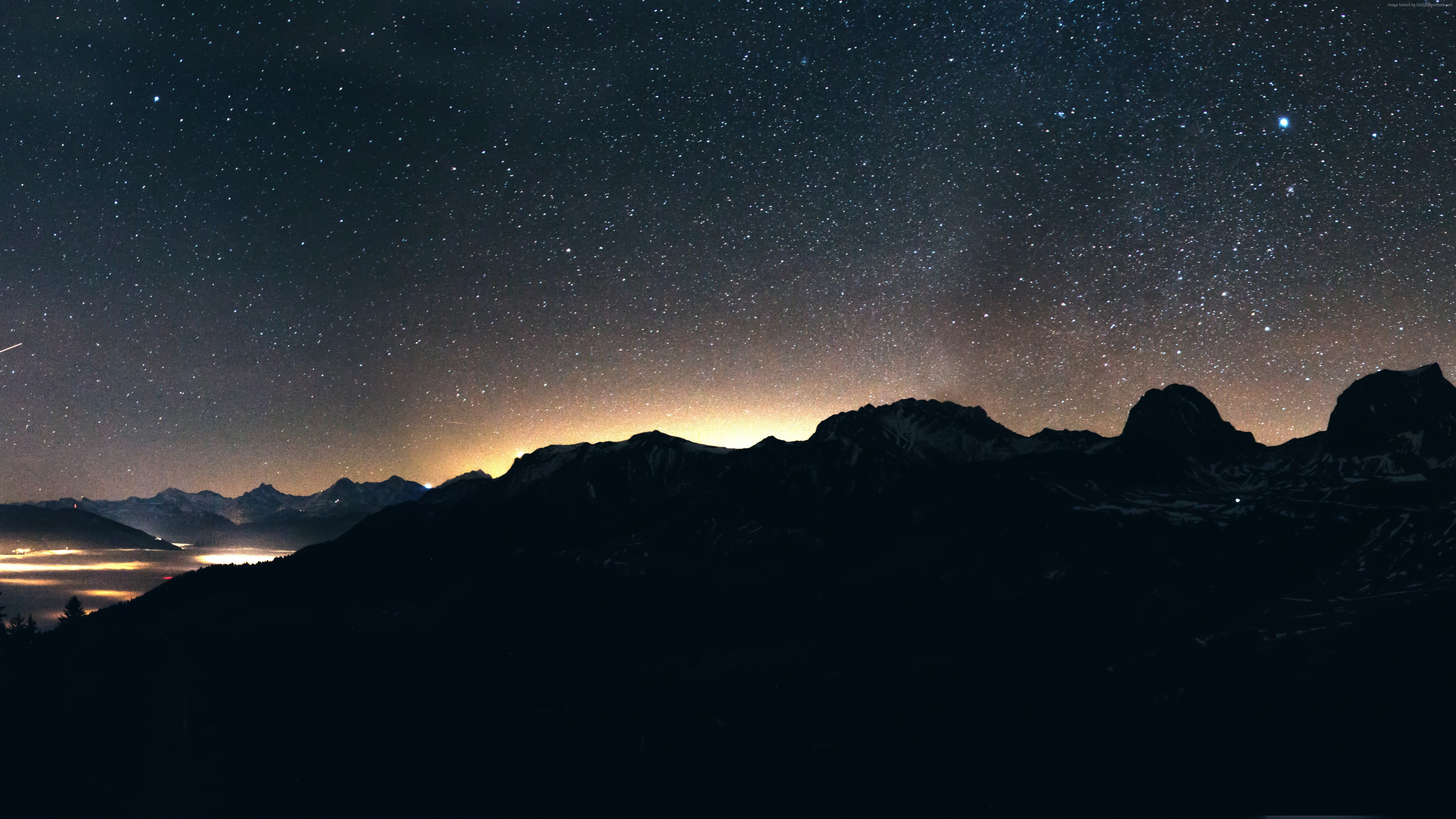 Mountains under a starry night sky HD Wallpaper