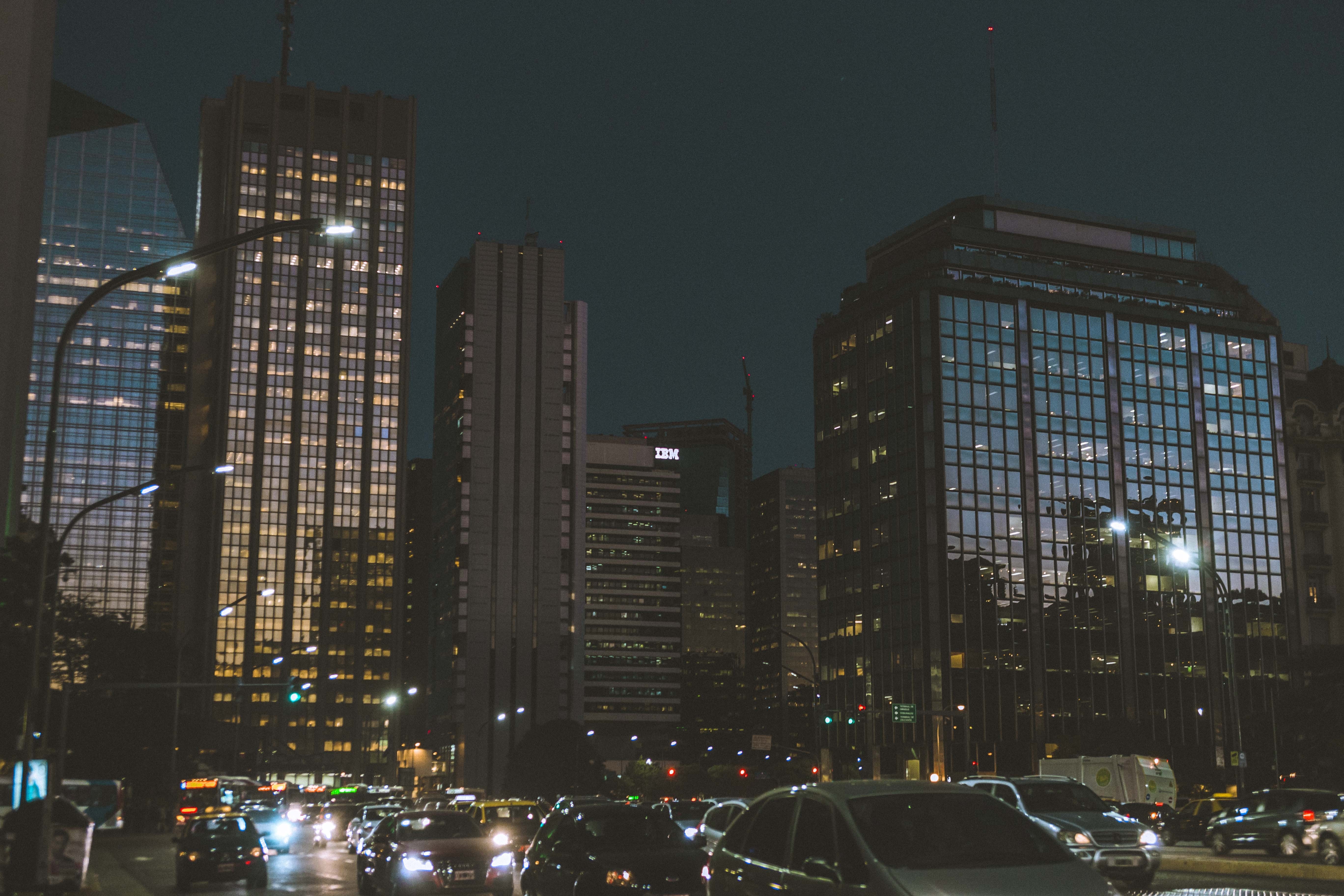 Cityscape at night with skyscrapers and traffic HD Wallpaper