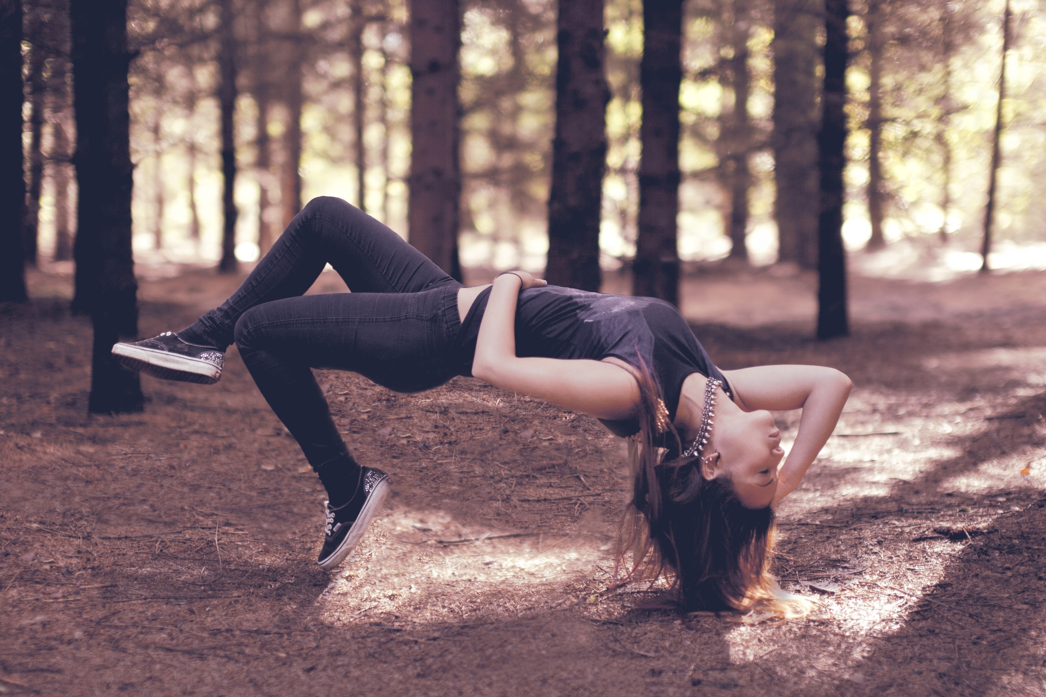 Woman levitating in a forest HD Wallpaper