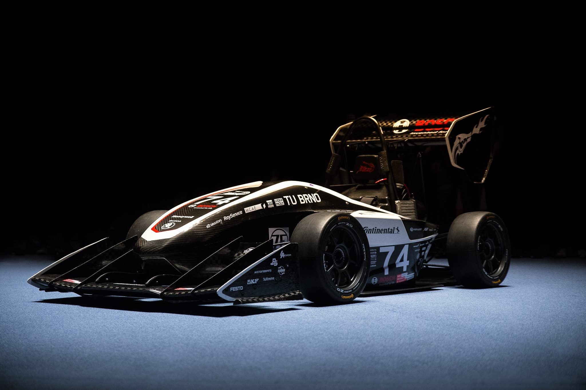 Formula 1 race car with TU BRNO branding HD Wallpaper