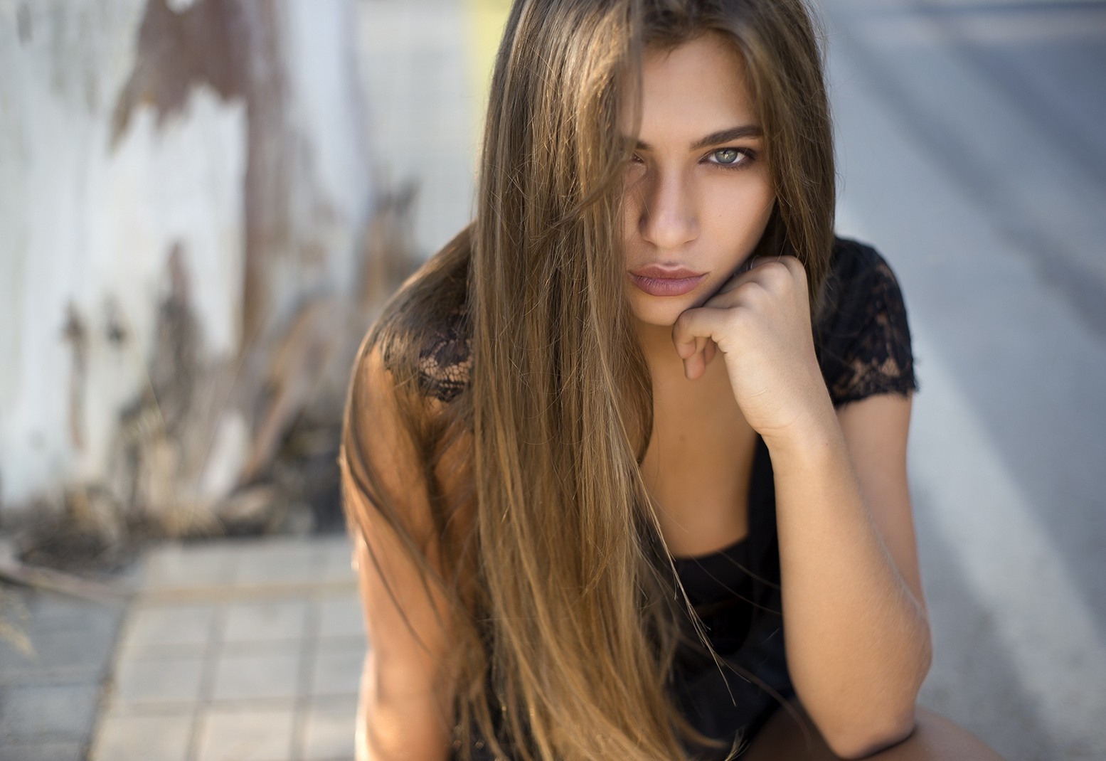 Portrait of a Pensive Woman with Long Hair HD Wallpaper