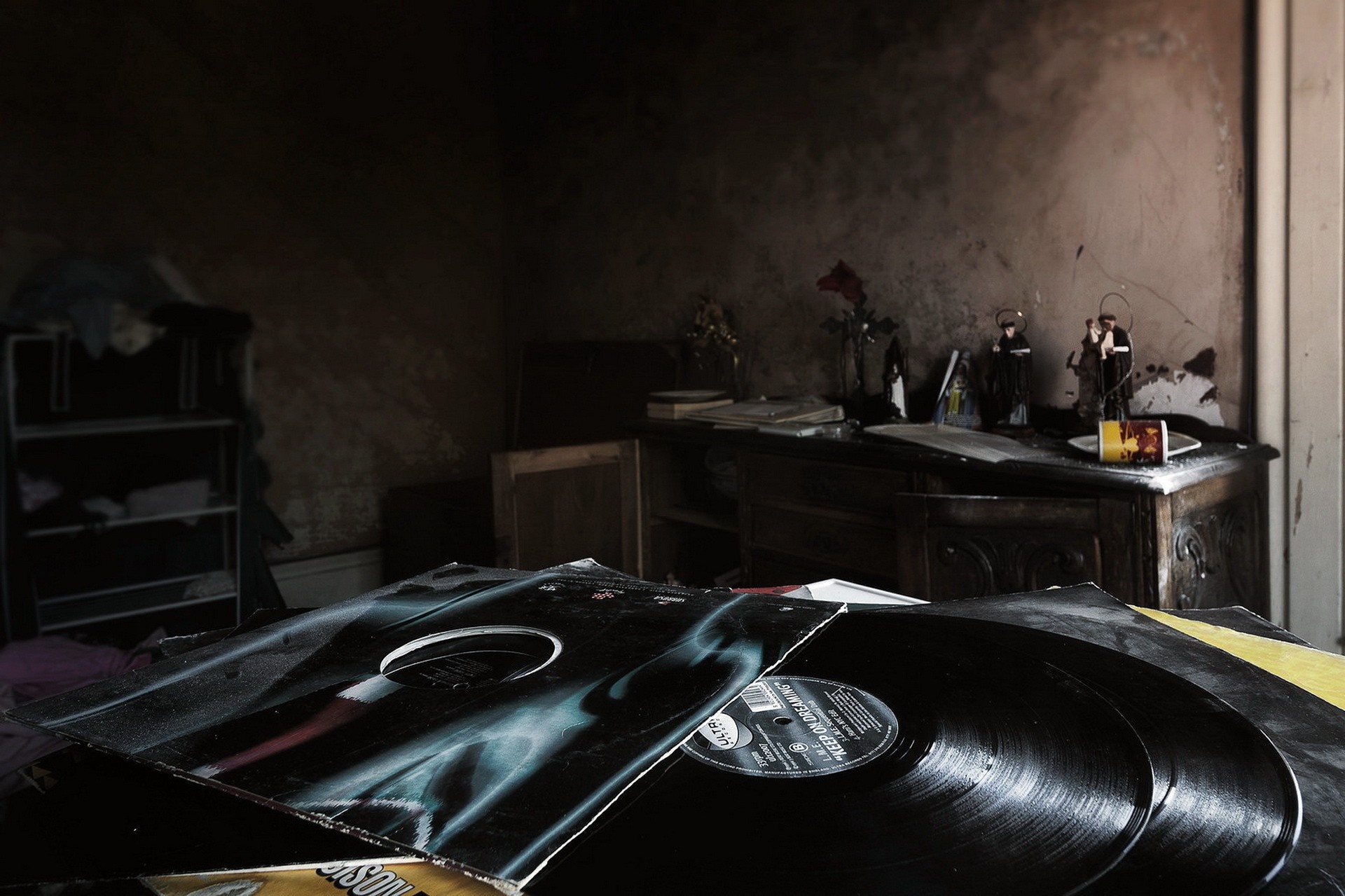 Vinyl records in a dark, dusty room HD Wallpaper