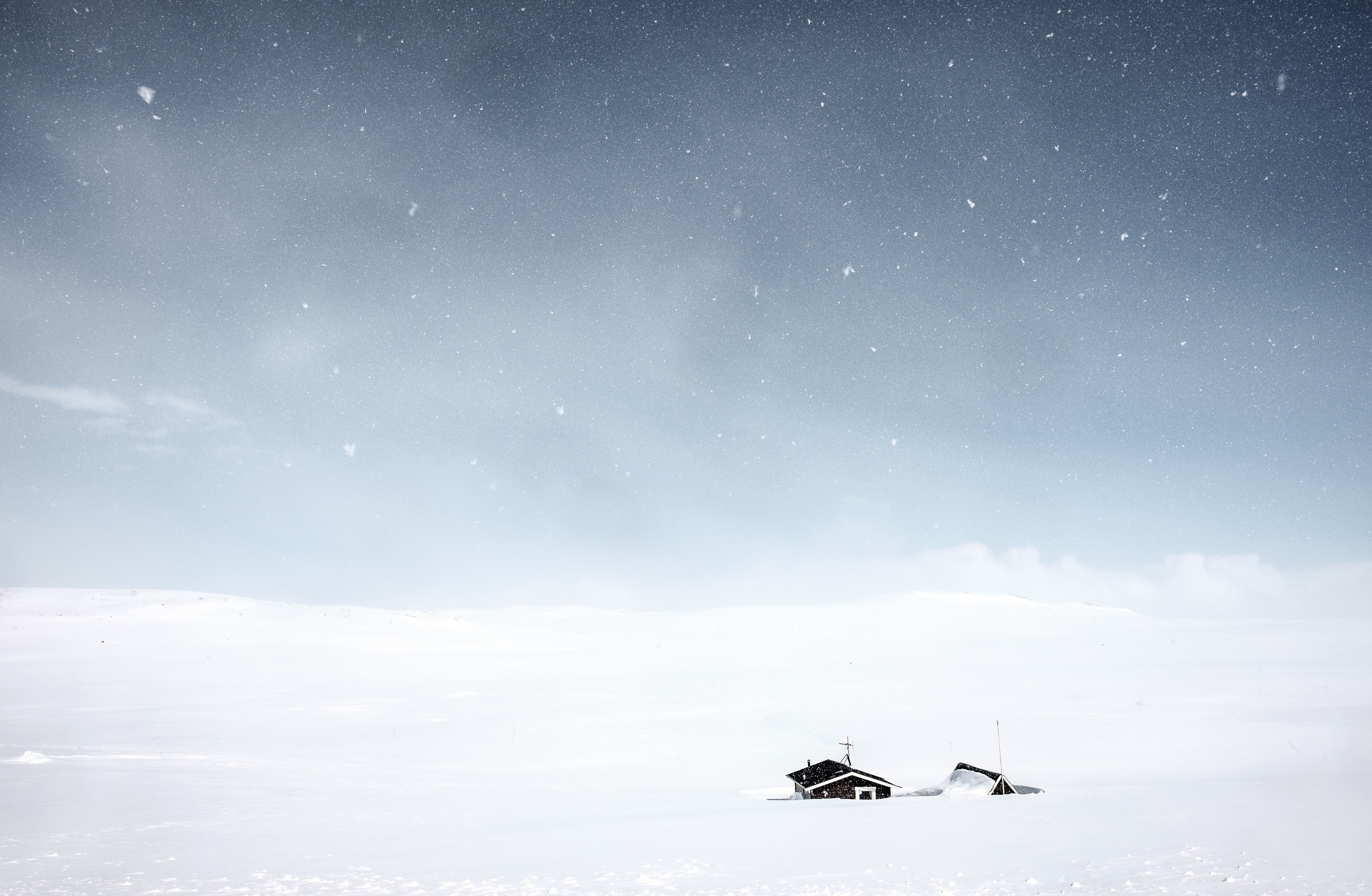 Two houses in a snowy landscape under a starry sky HD Wallpaper