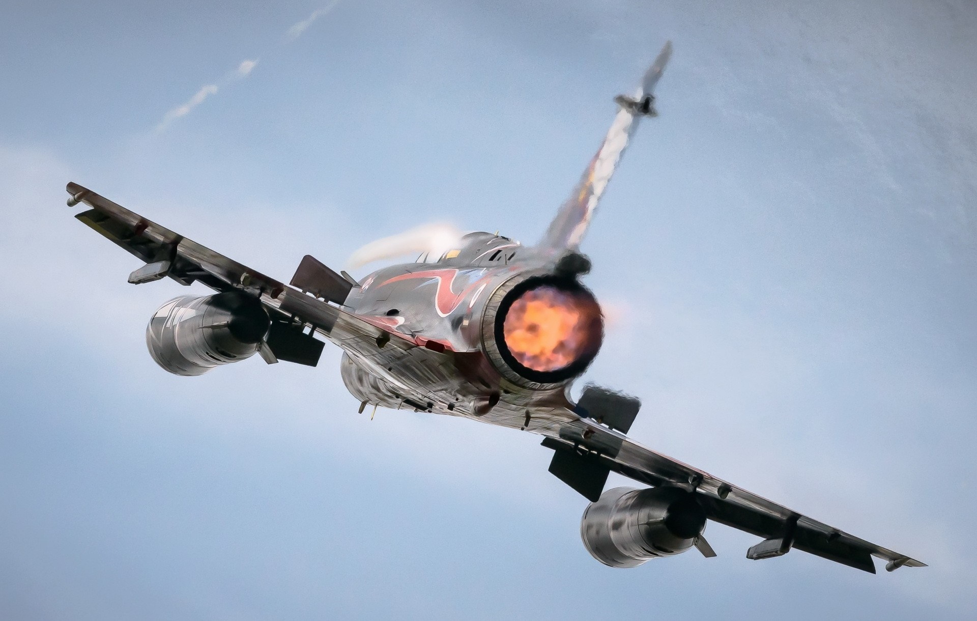 Rear view of a Mirage 2000 fighter jet in flight HD Wallpaper