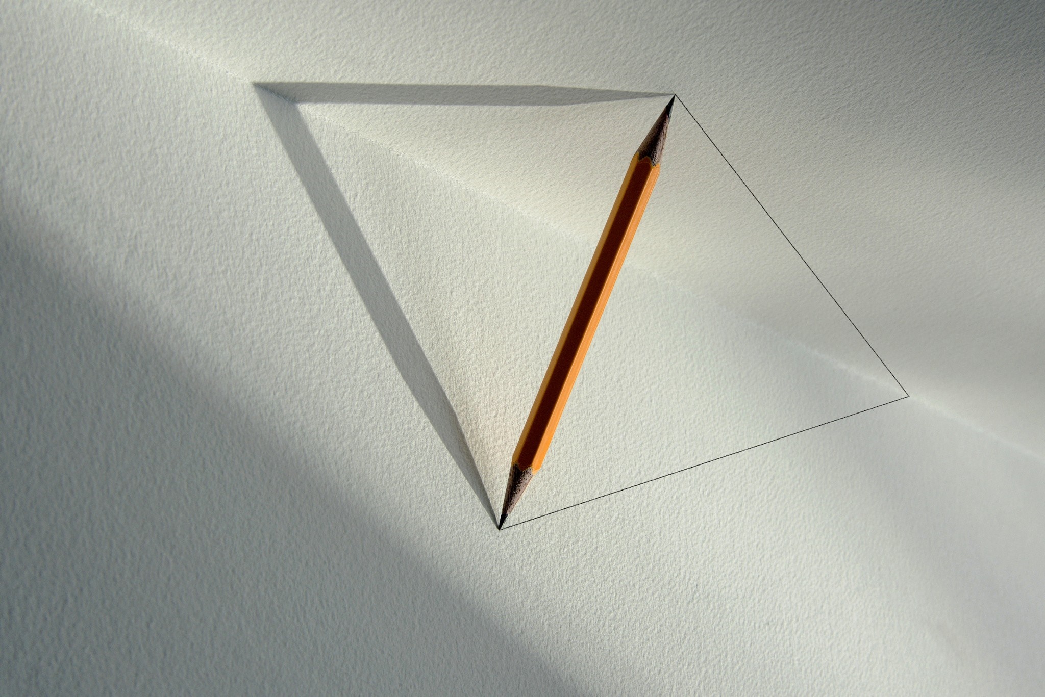 Pencil drawing a triangle on textured paper with shadows HD Wallpaper