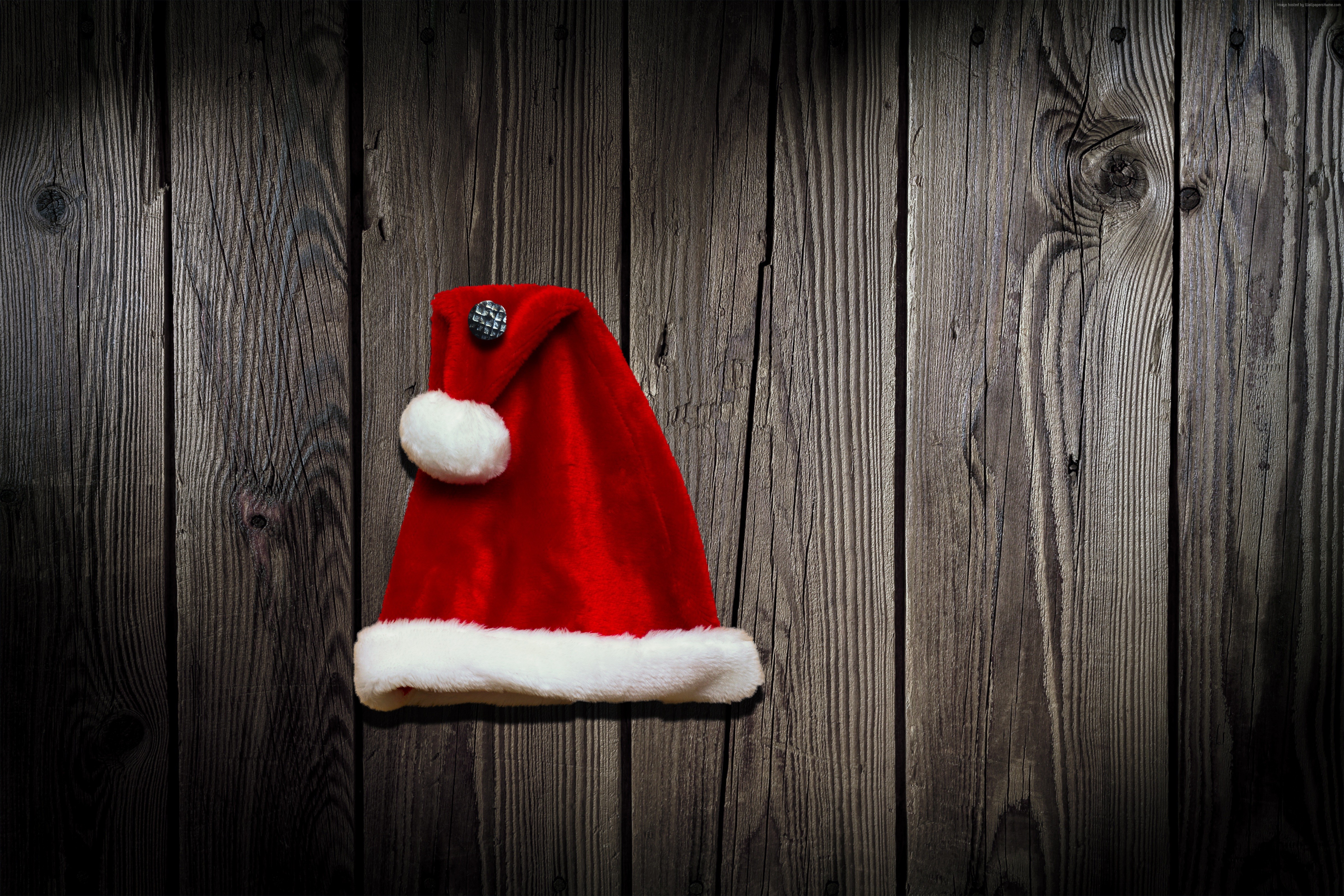 Santa hat on wooden background HD Wallpaper