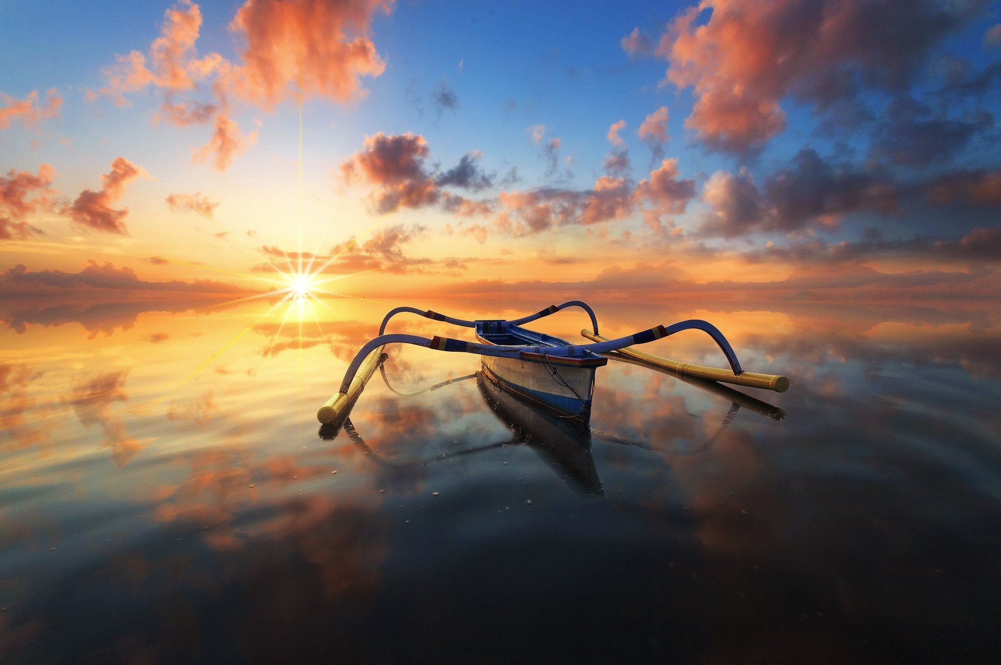 Boat on calm water during sunset with colorful clouds HD Wallpaper