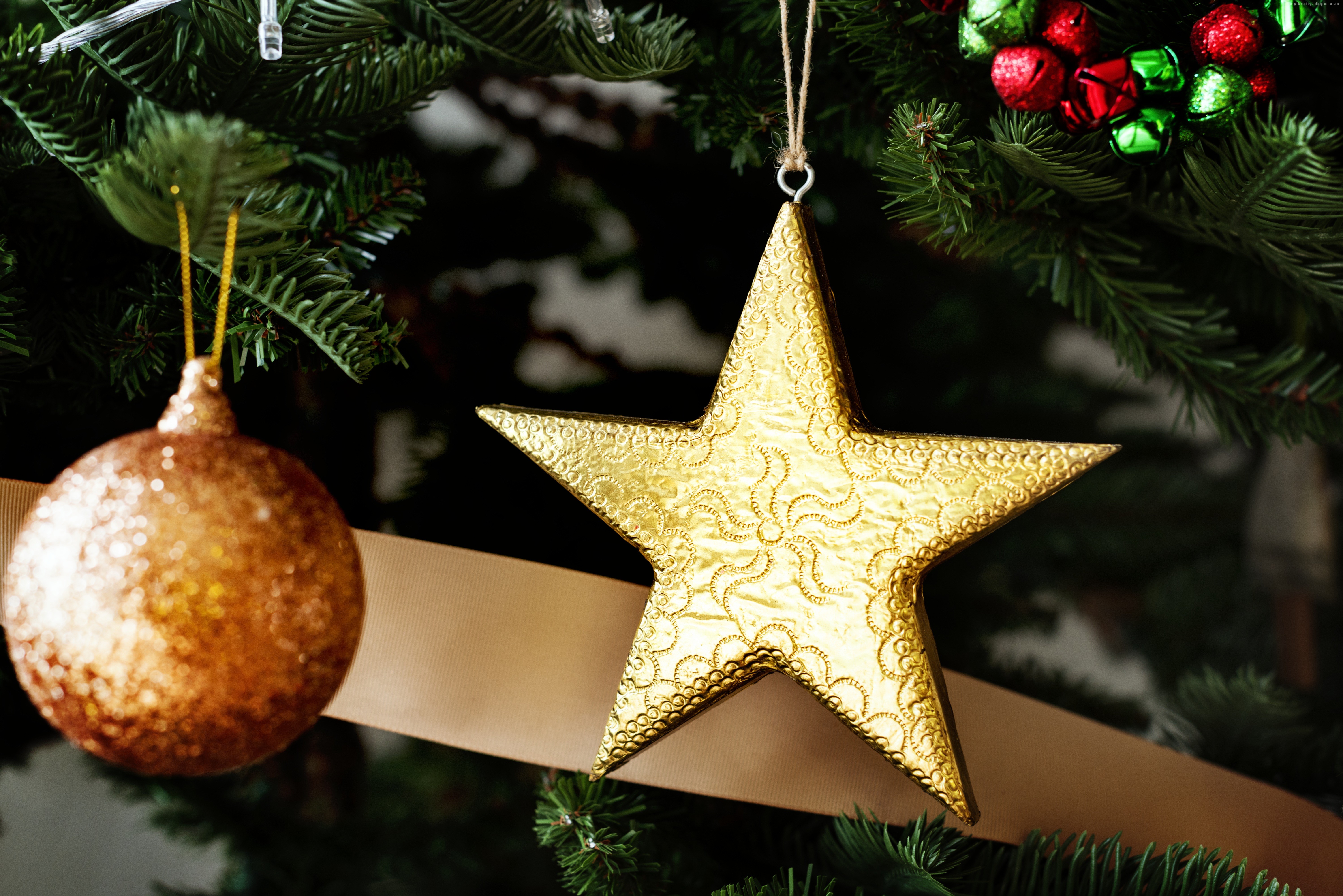 Golden star and bauble Christmas ornaments on a tree HD Wallpaper
