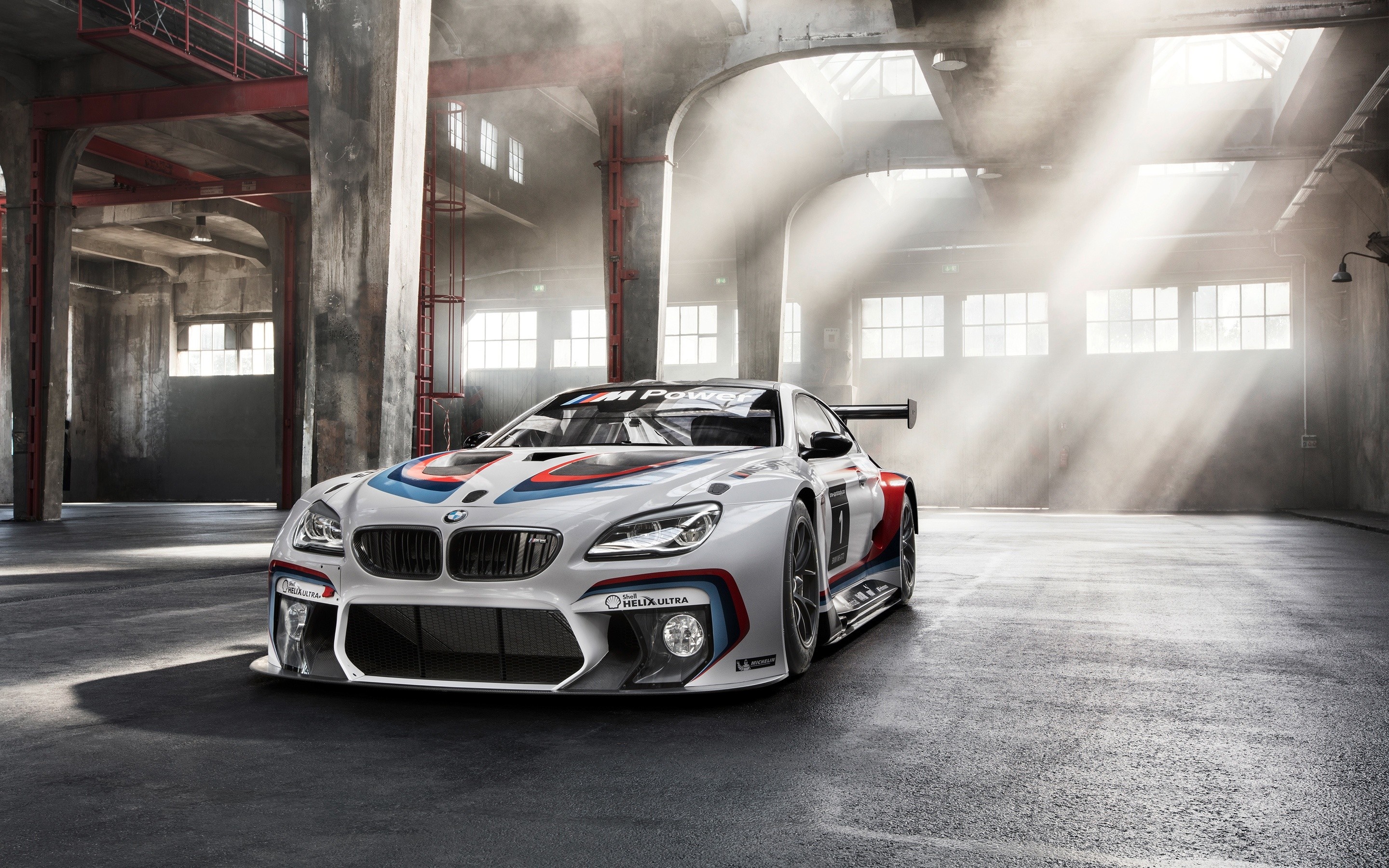 BMW M6 GT3 race car in a warehouse HD Wallpaper