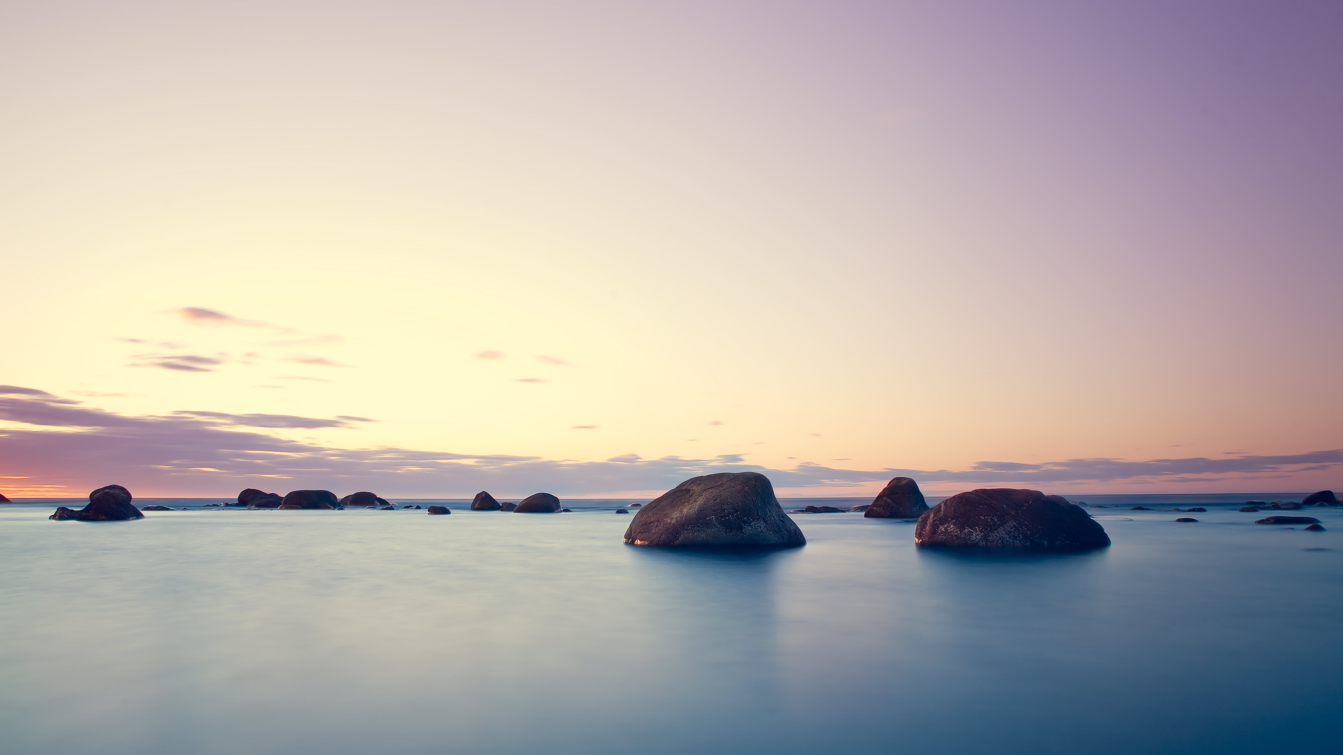 Ocean sunset with rocks and clouds HD Wallpaper