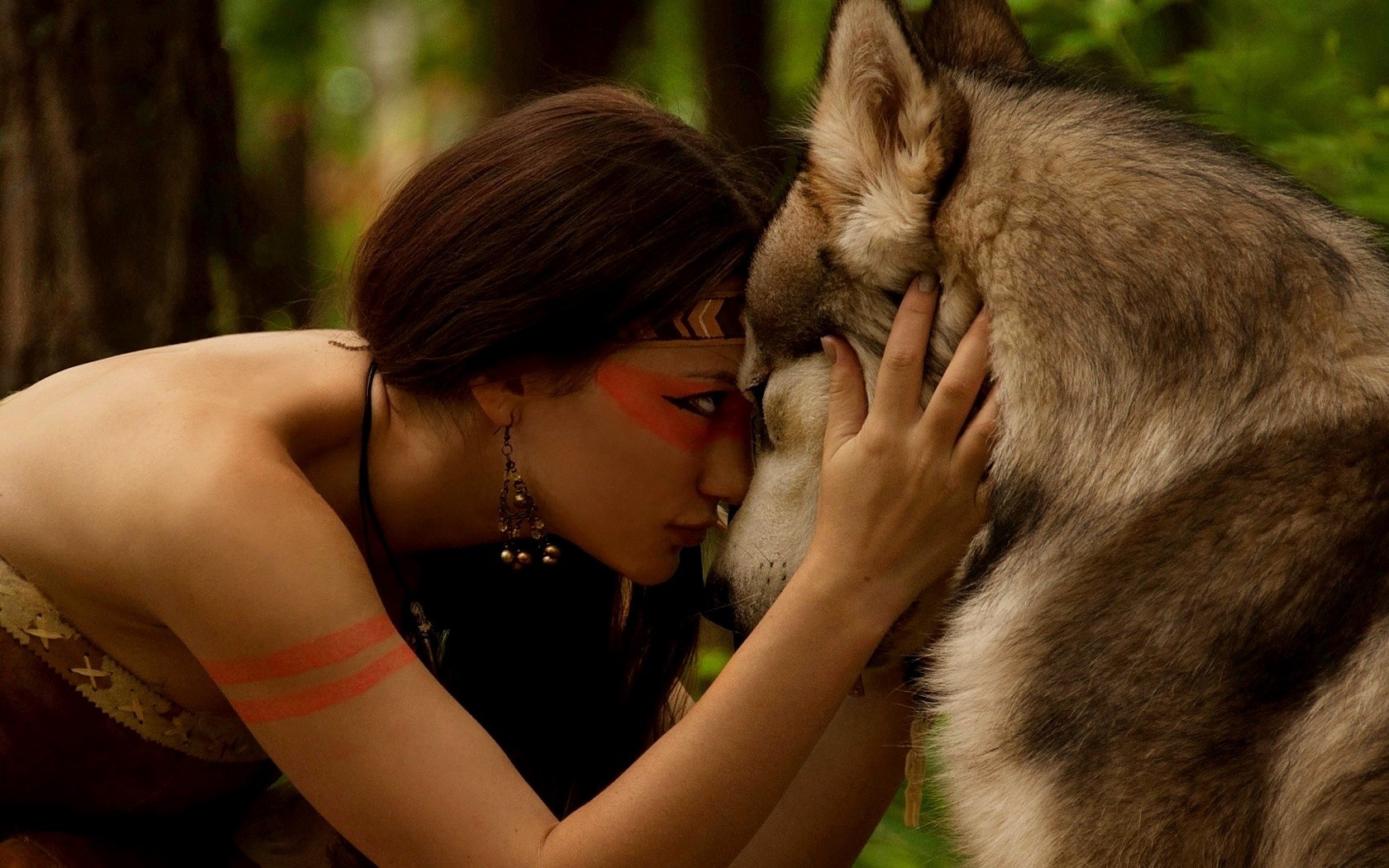 Woman with face paint and wolf in forest HD Wallpaper