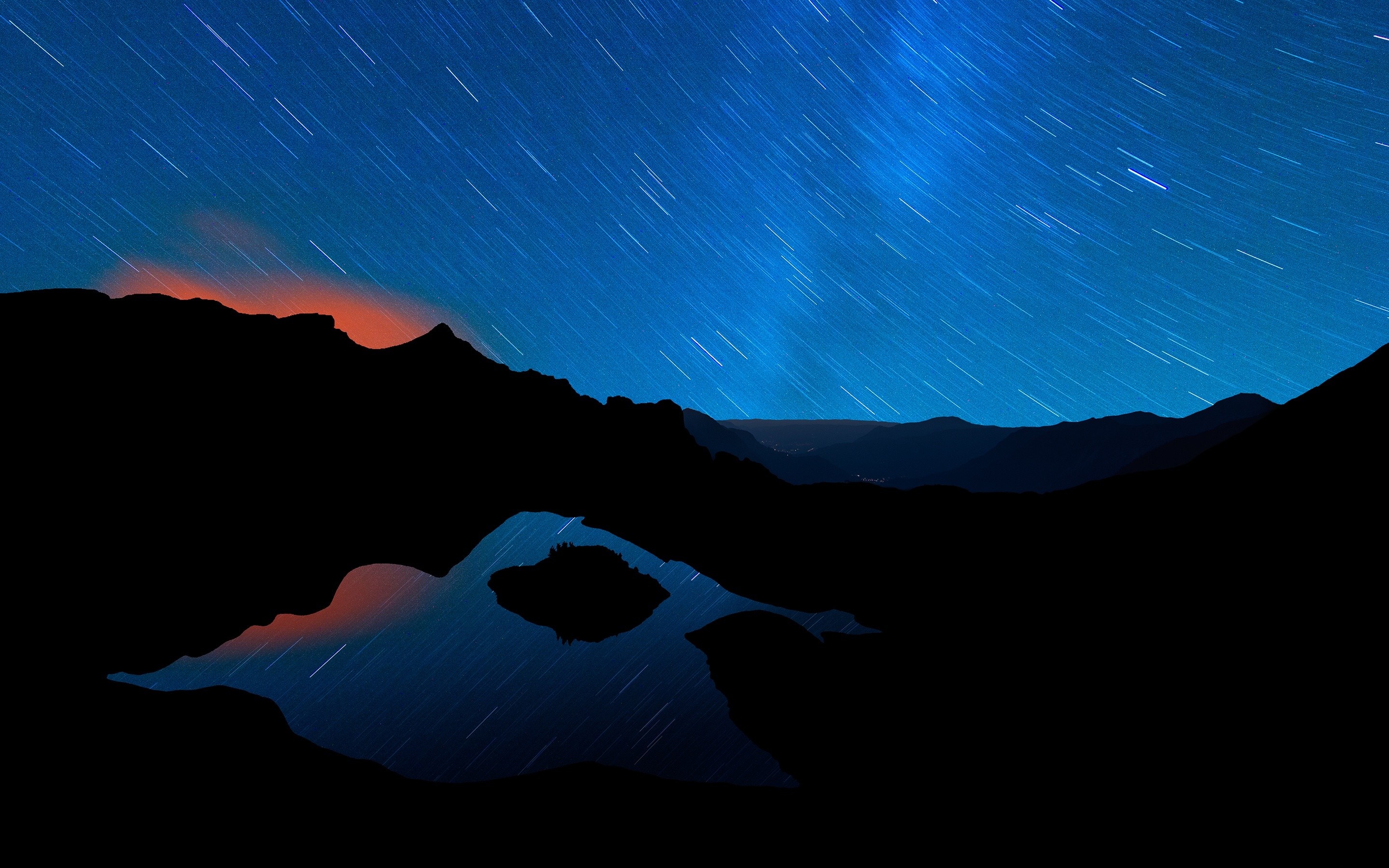 Star trails over mountains and lake at night HD Wallpaper