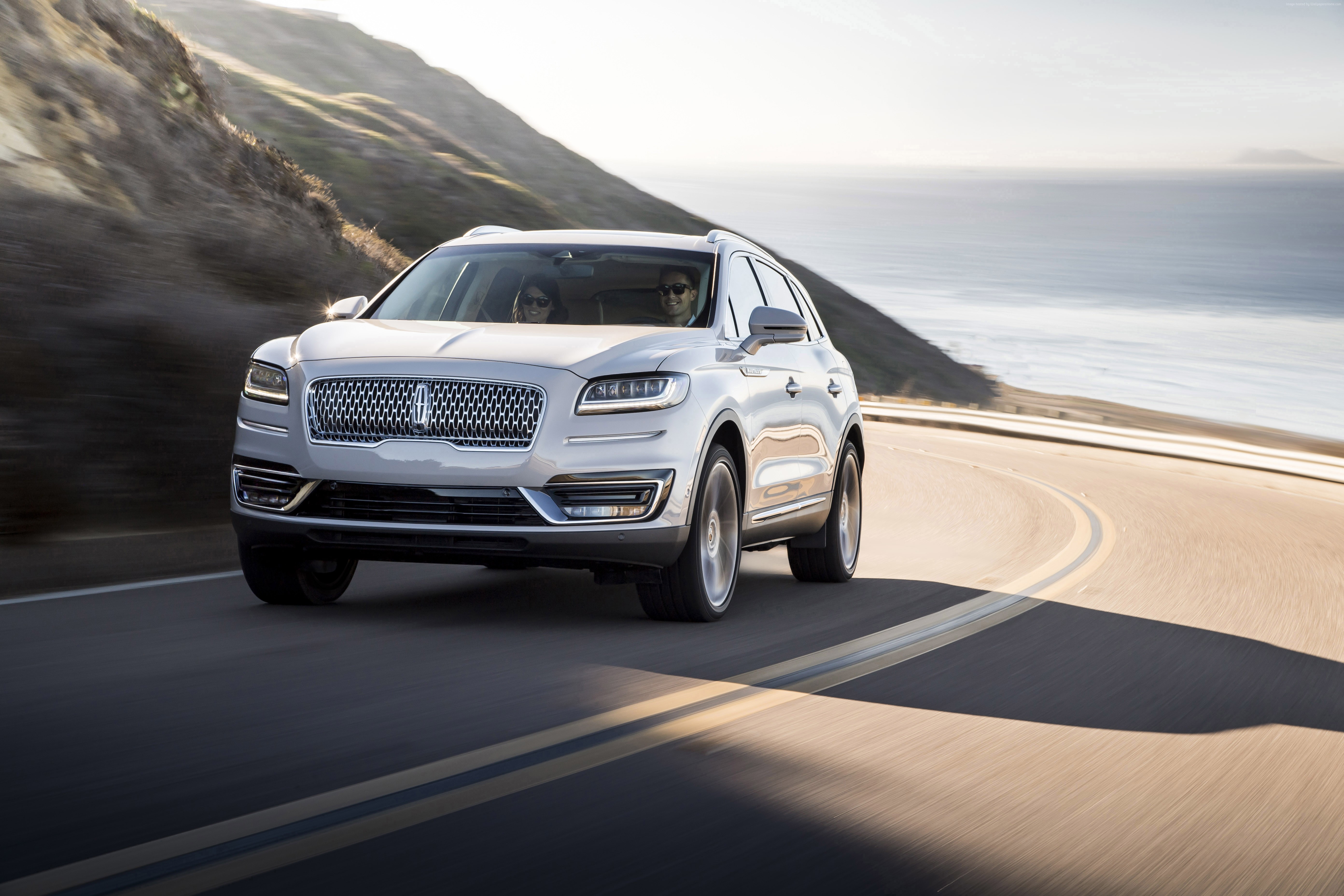 2018 Lincoln Nautilus driving on coastal road HD Wallpaper