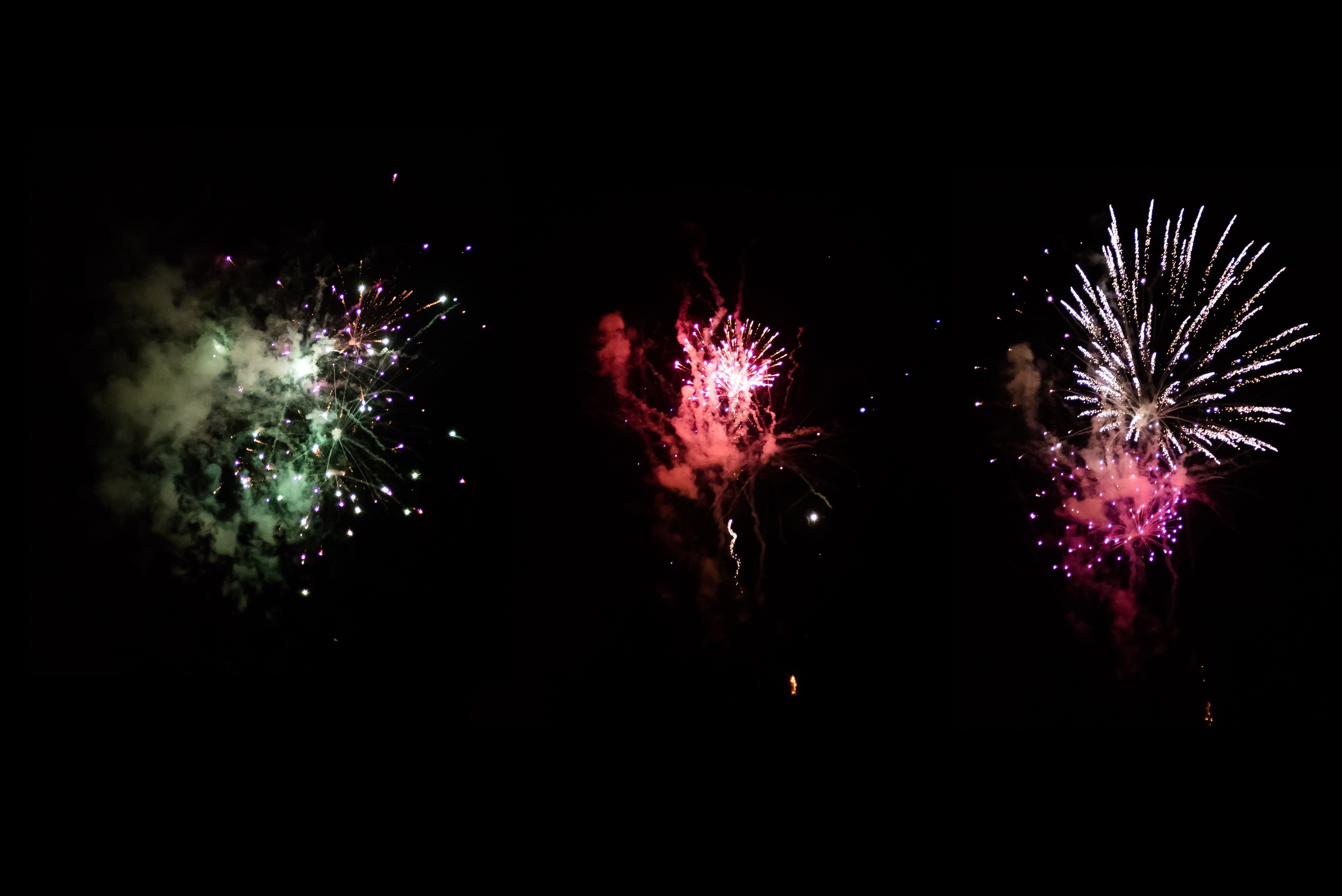 Fireworks exploding in the night sky HD Wallpaper